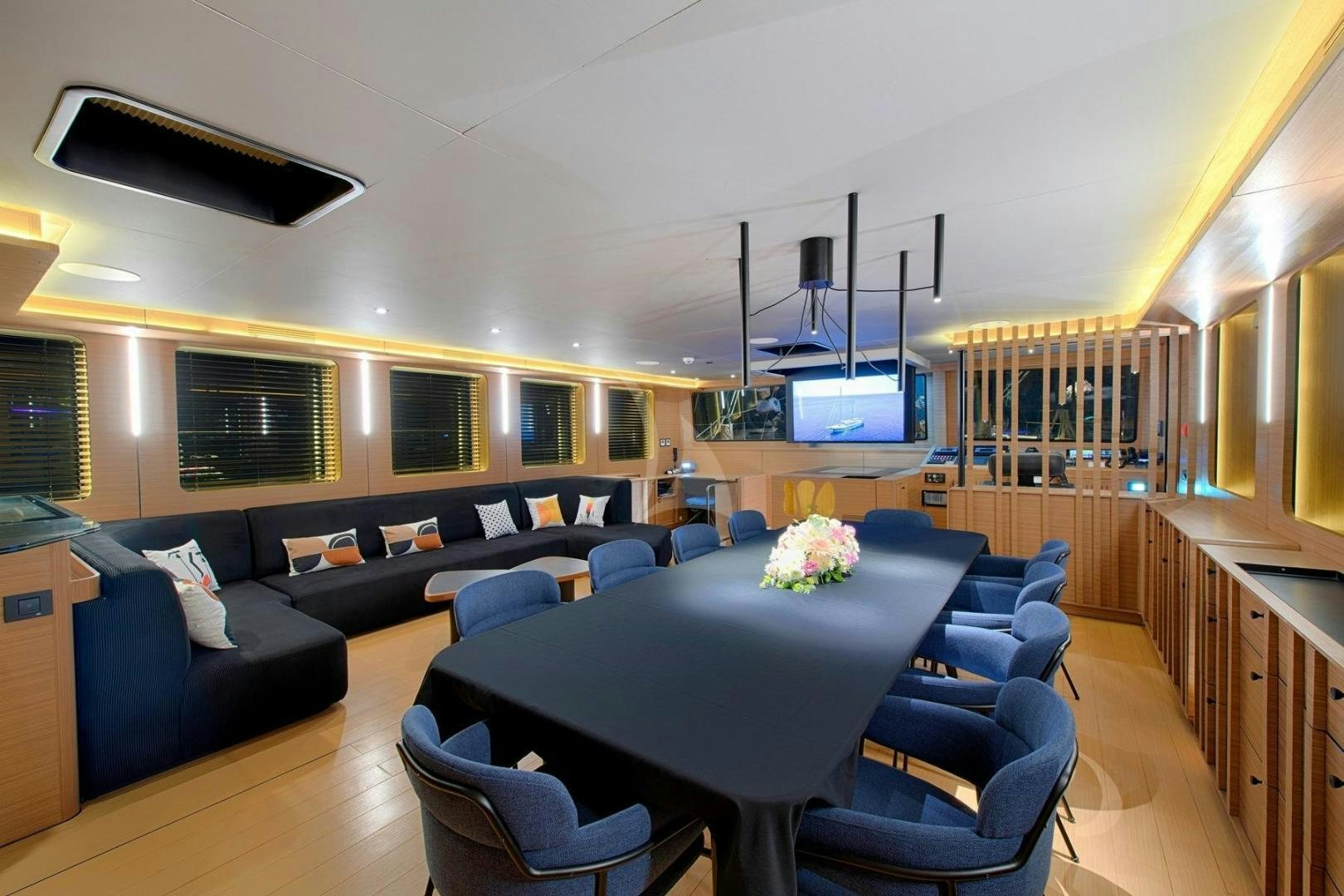 a room with a table and chairs aboard MITI ONE Yacht for Sale