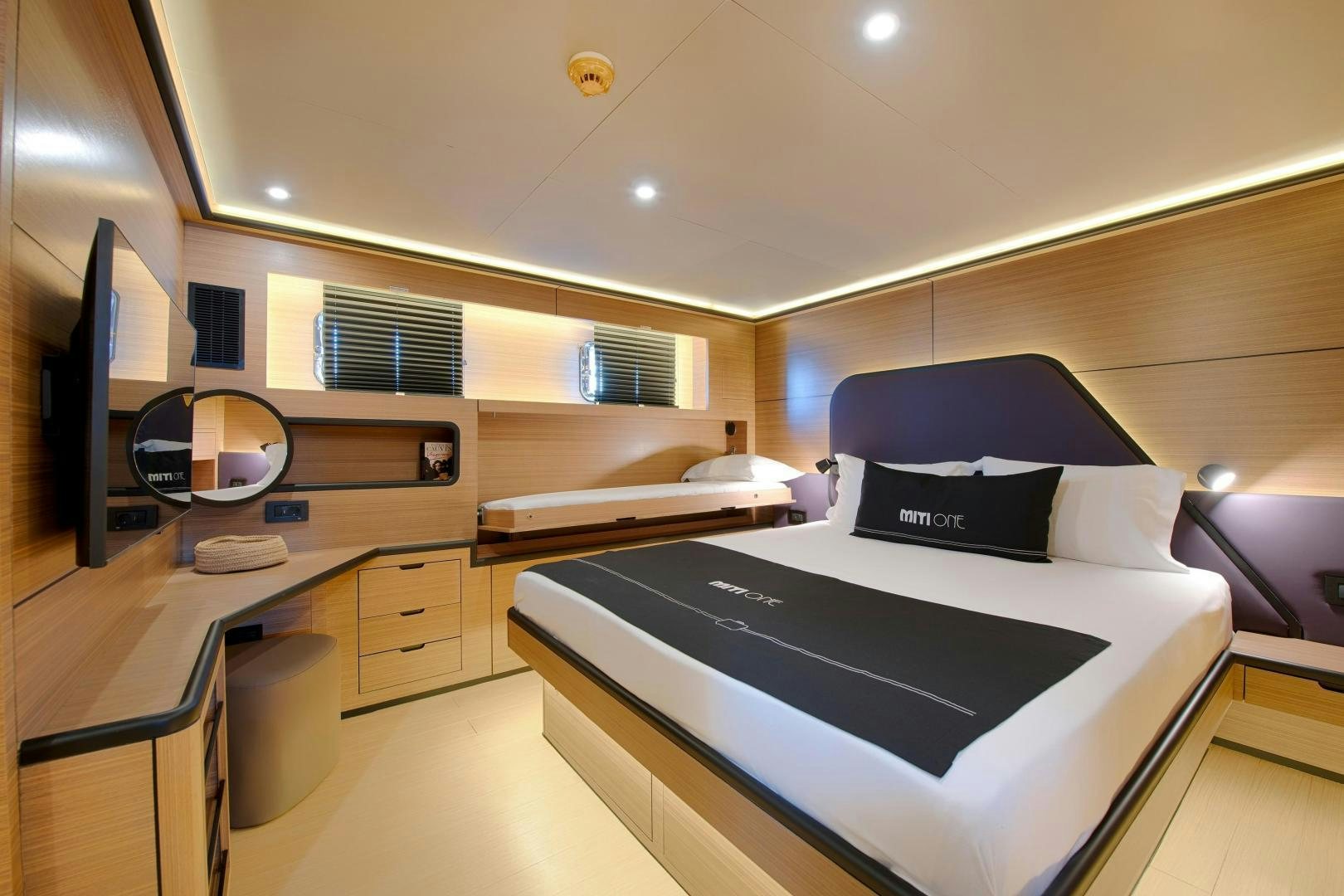a bedroom with a large bed aboard MITI ONE Yacht for Sale