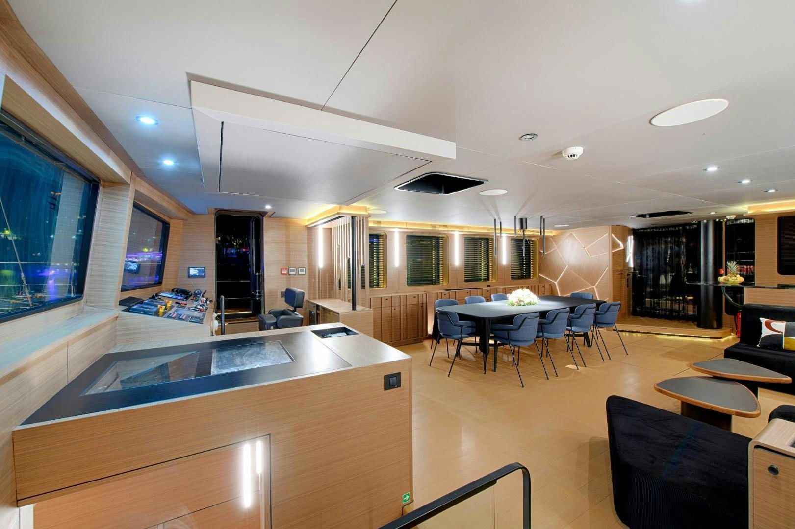 a large kitchen with a bar and dining area aboard MITI ONE Yacht for Sale