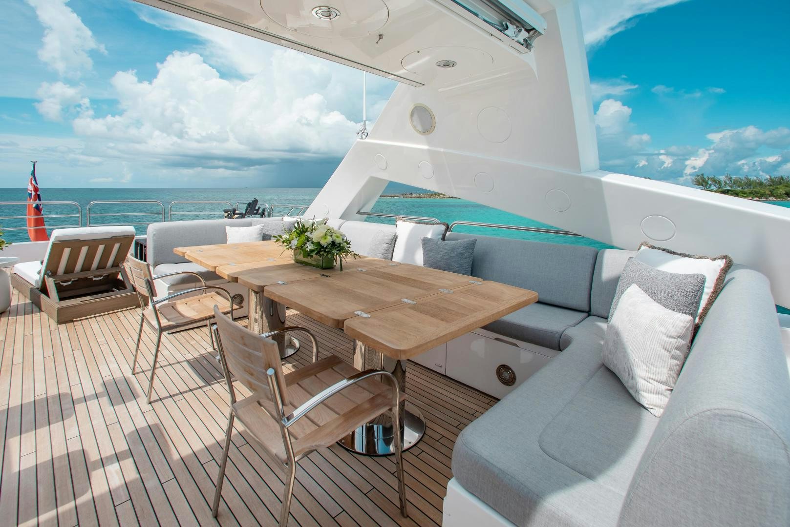 a room with a table chairs and a large window aboard ACACIA Yacht for Sale