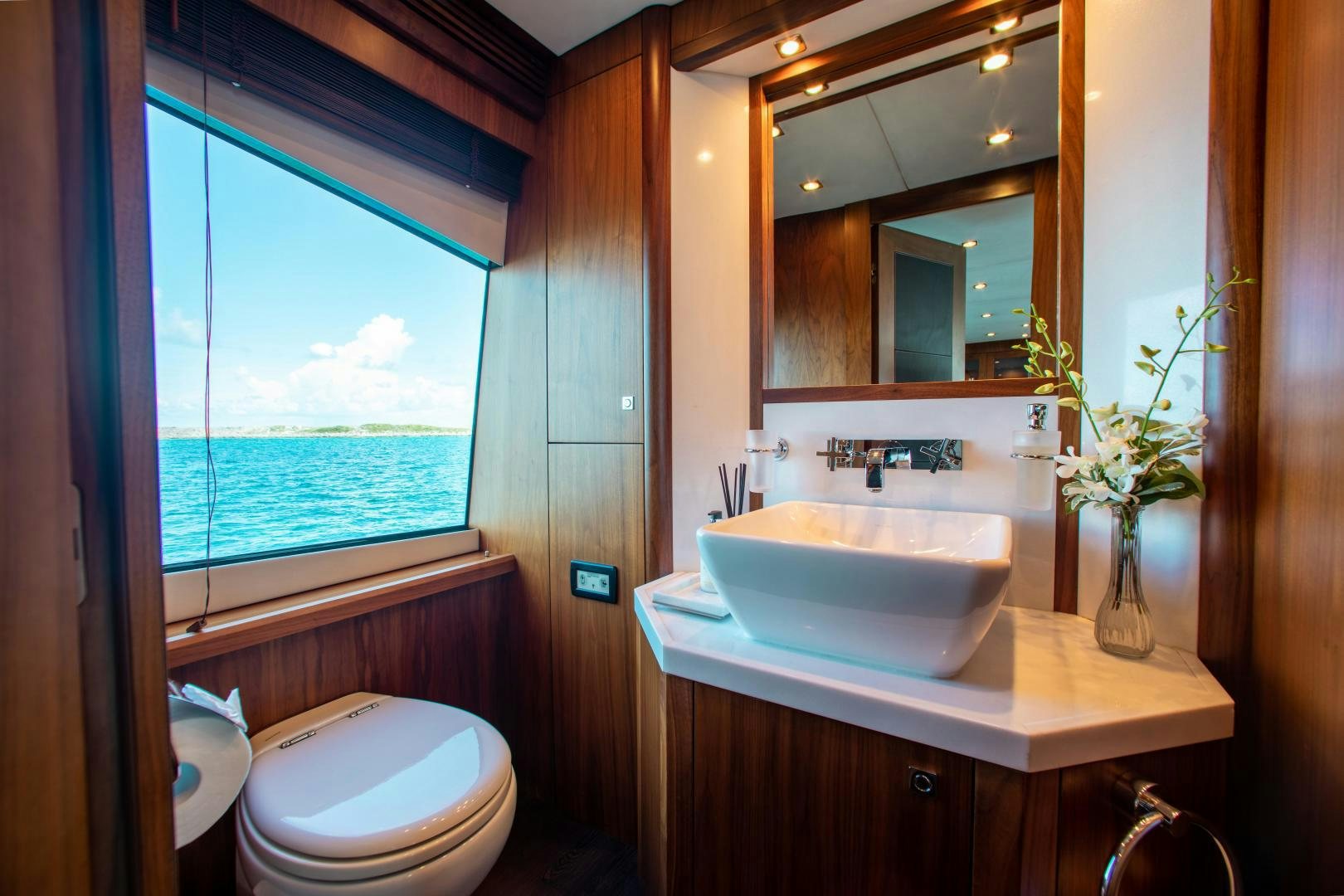 a bathroom with a sink and a toilet aboard ACACIA Yacht for Sale