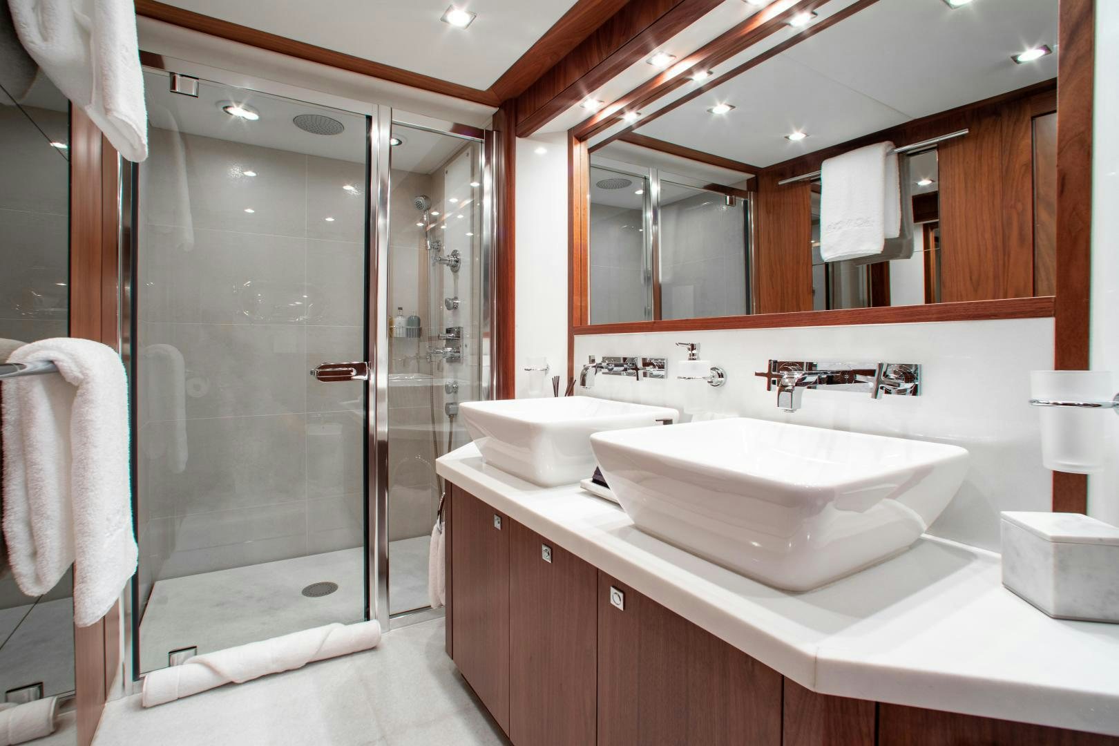 a bathroom with a shower sink and mirror aboard ACACIA Yacht for Sale