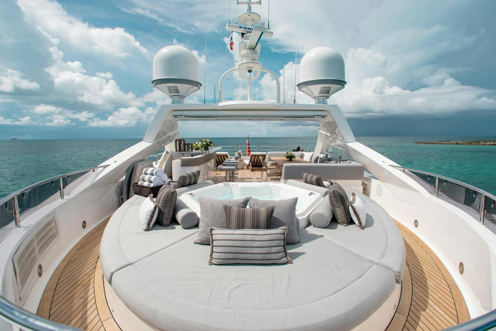 a deck with a large ship on it and a large ship in the water aboard ACACIA Yacht for Sale