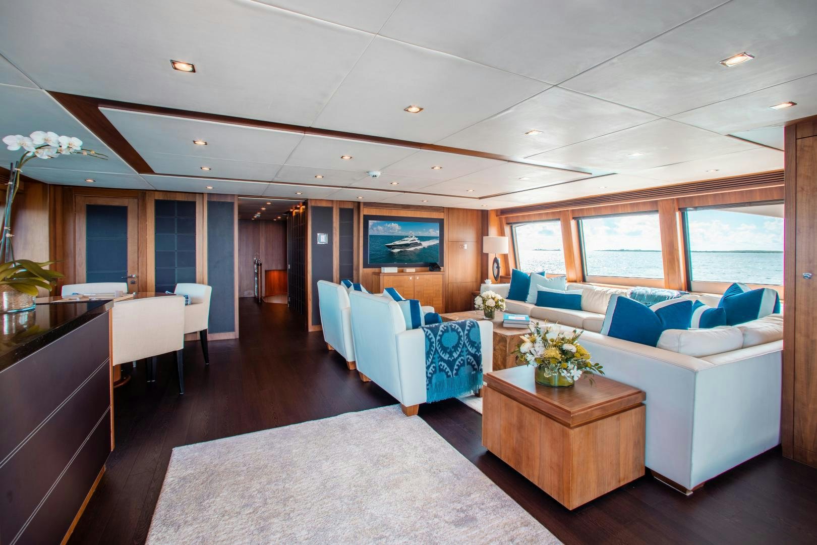 a living room with a couch and a table aboard ACACIA Yacht for Sale