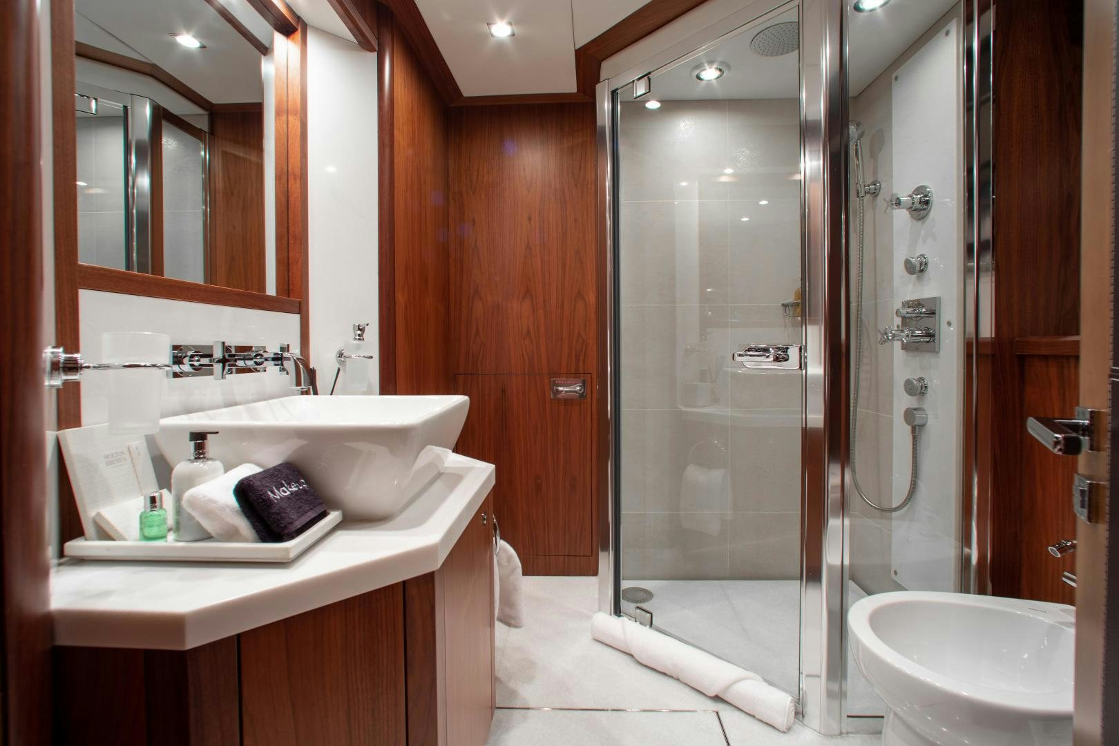 a bathroom with a glass shower aboard ACACIA Yacht for Sale