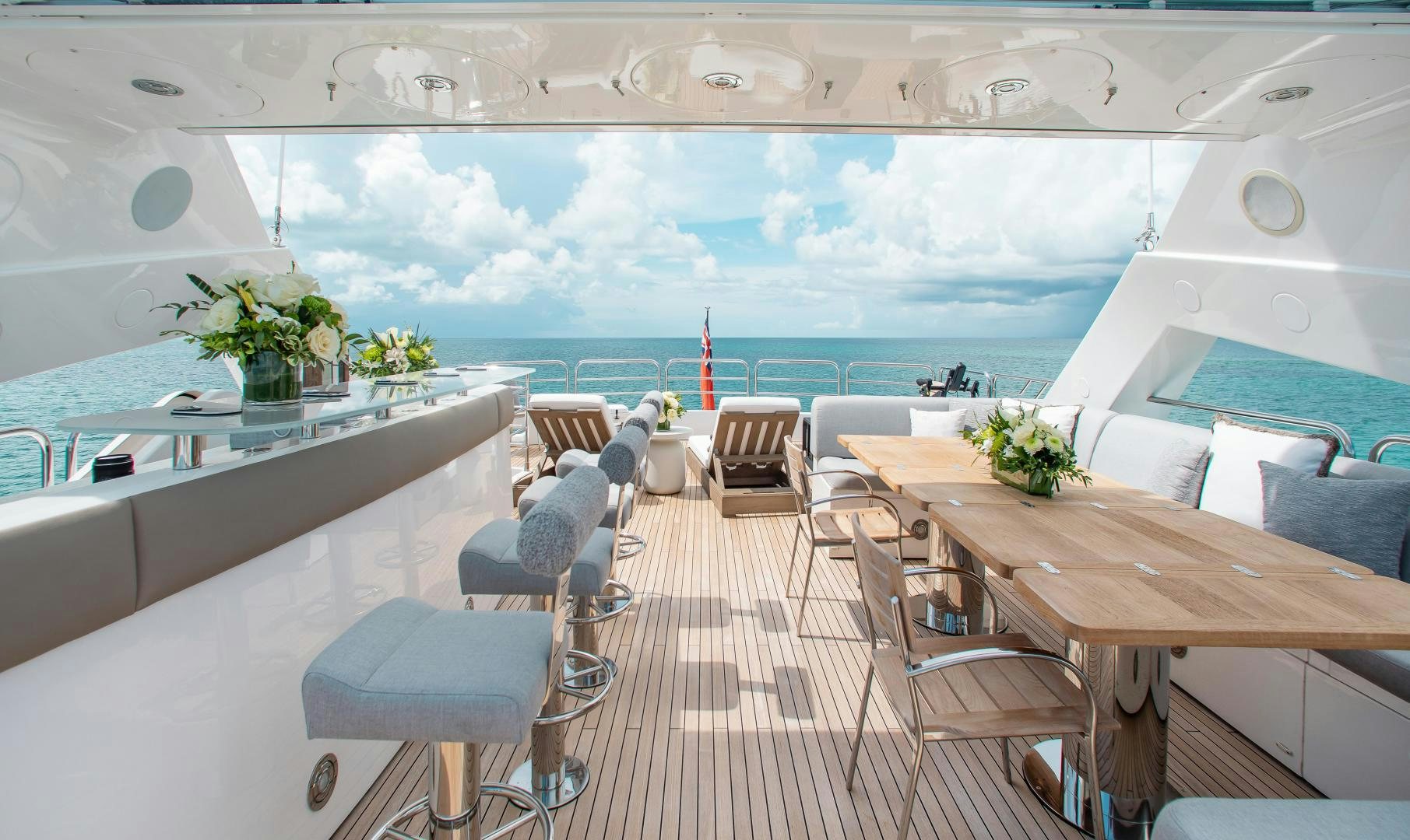 a room with tables and chairs aboard ACACIA Yacht for Sale