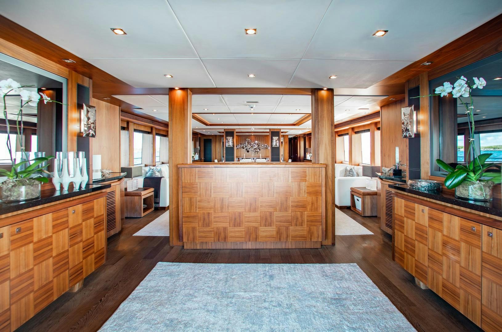 a large room with a large wood cabinet and a large mirror aboard ACACIA Yacht for Sale