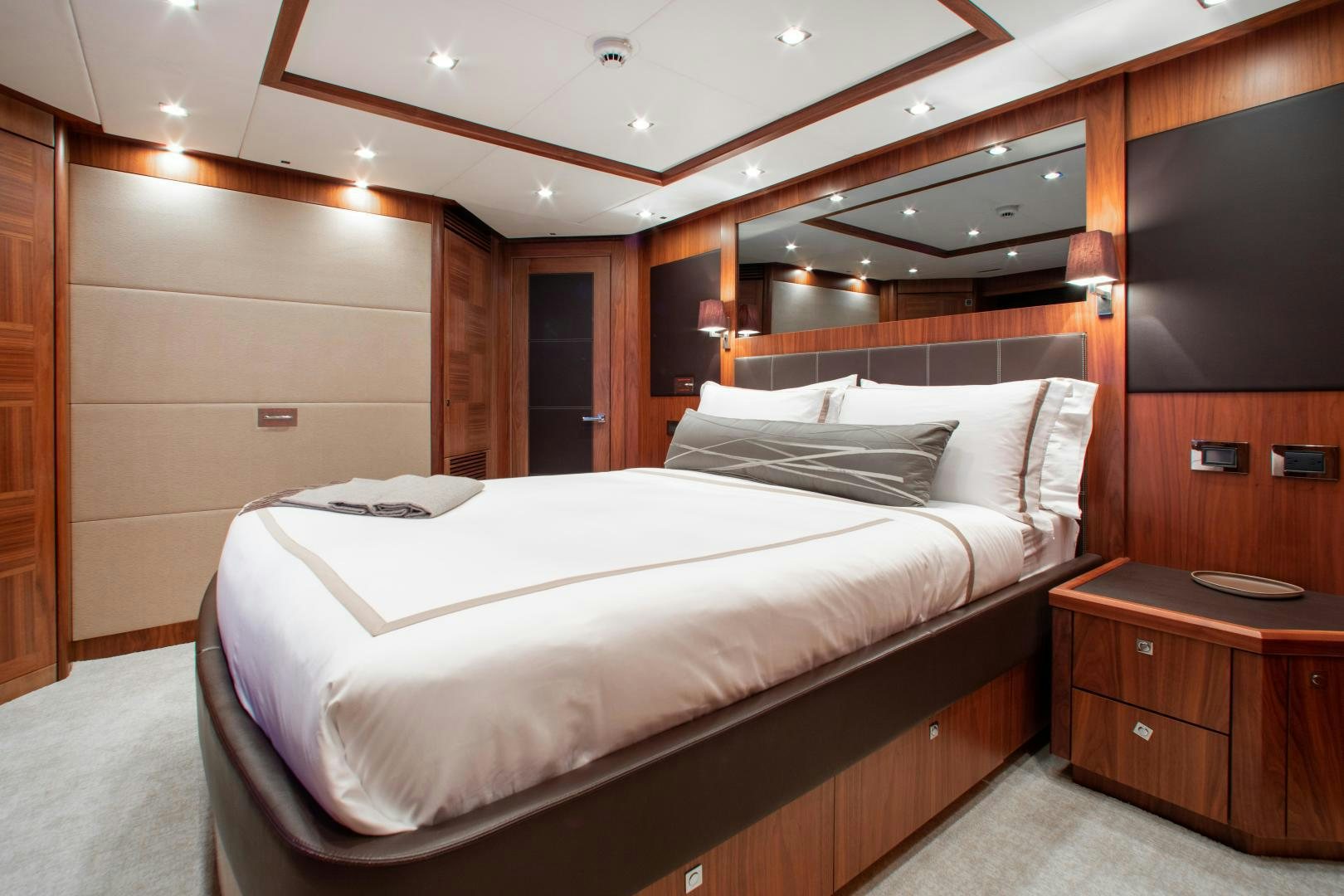 a bed with white sheets aboard ACACIA Yacht for Sale