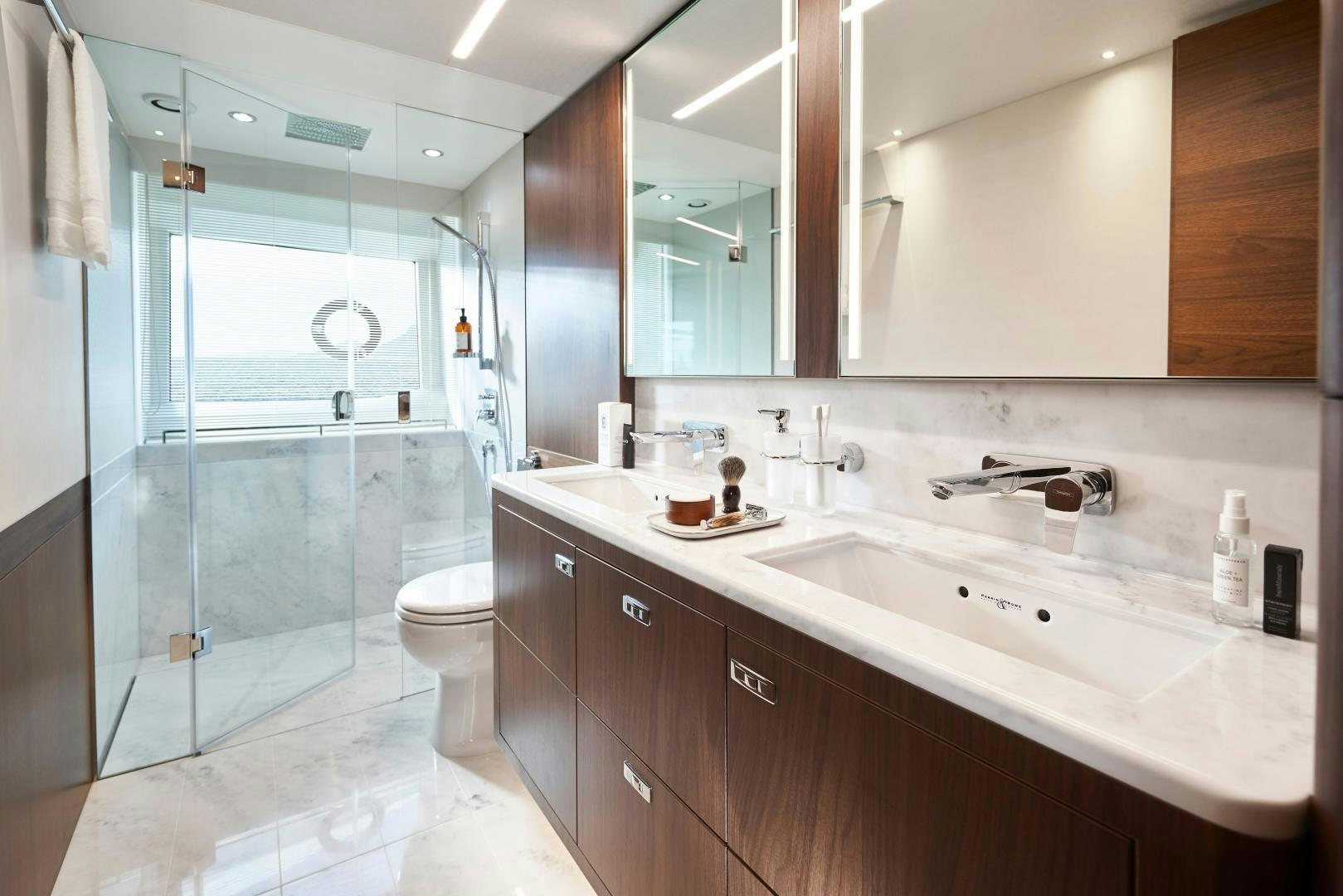 a bathroom with a glass shower aboard PLAY TO WIN Yacht for Sale