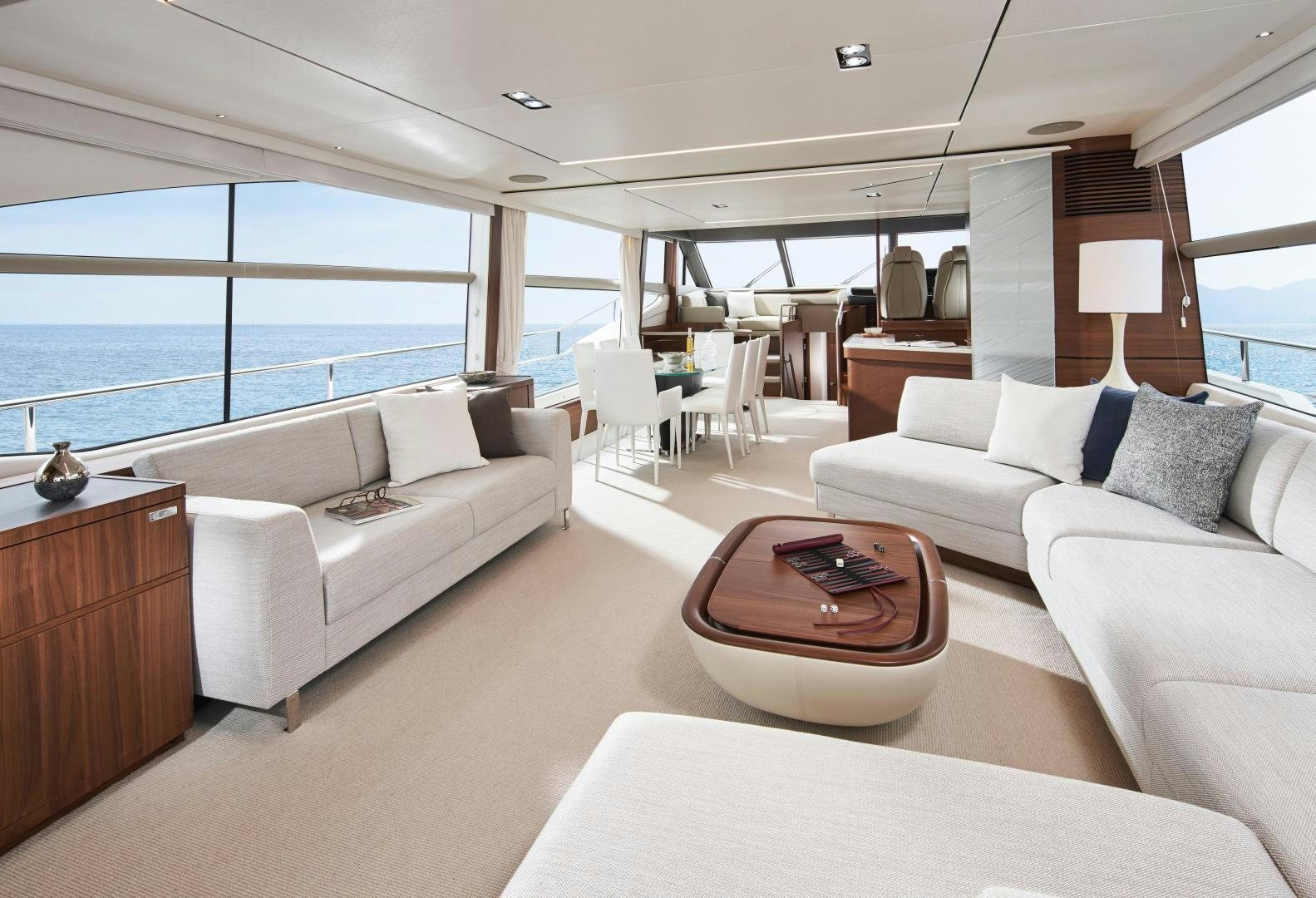 a living room with a large window aboard PLAY TO WIN Yacht for Sale