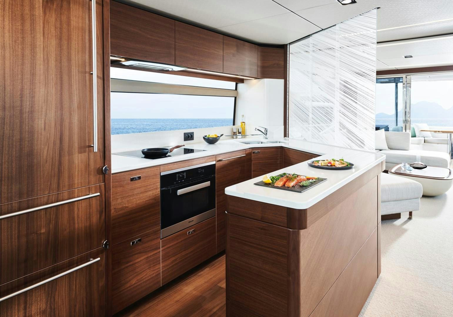 a kitchen with wooden cabinets aboard PLAY TO WIN Yacht for Sale