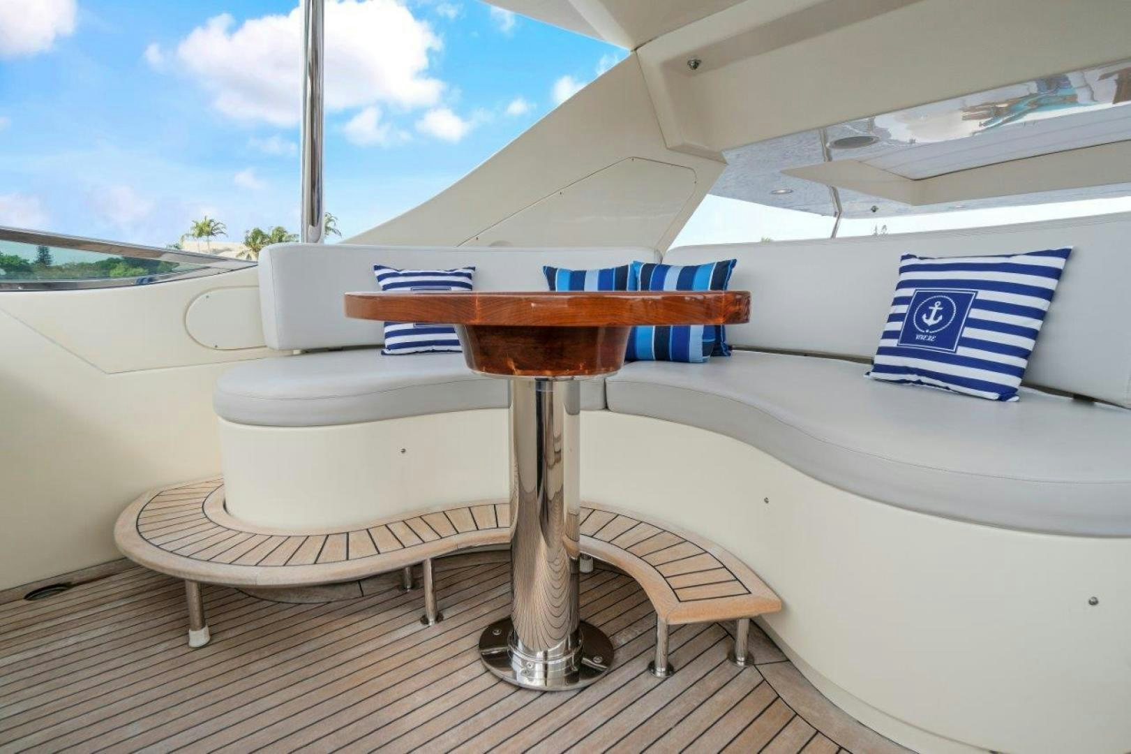 a table with a chair on it aboard VIVERE Yacht for Sale