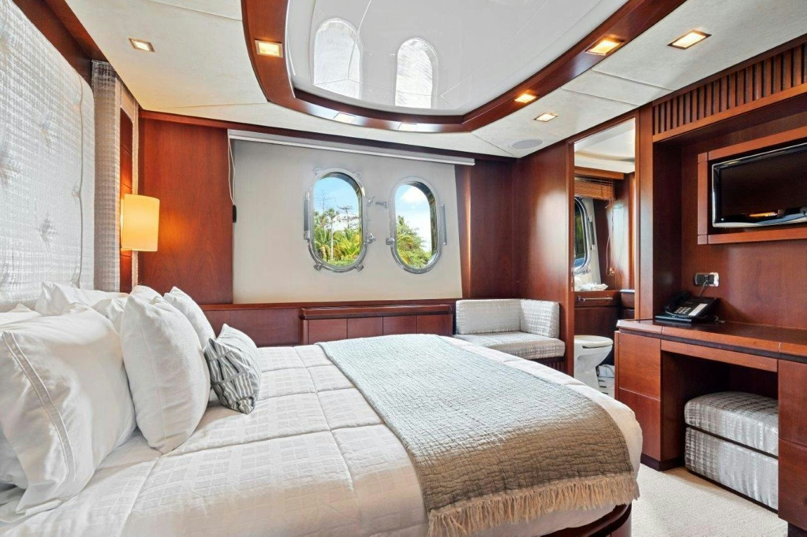 a bed in a room aboard VIVERE Yacht for Sale