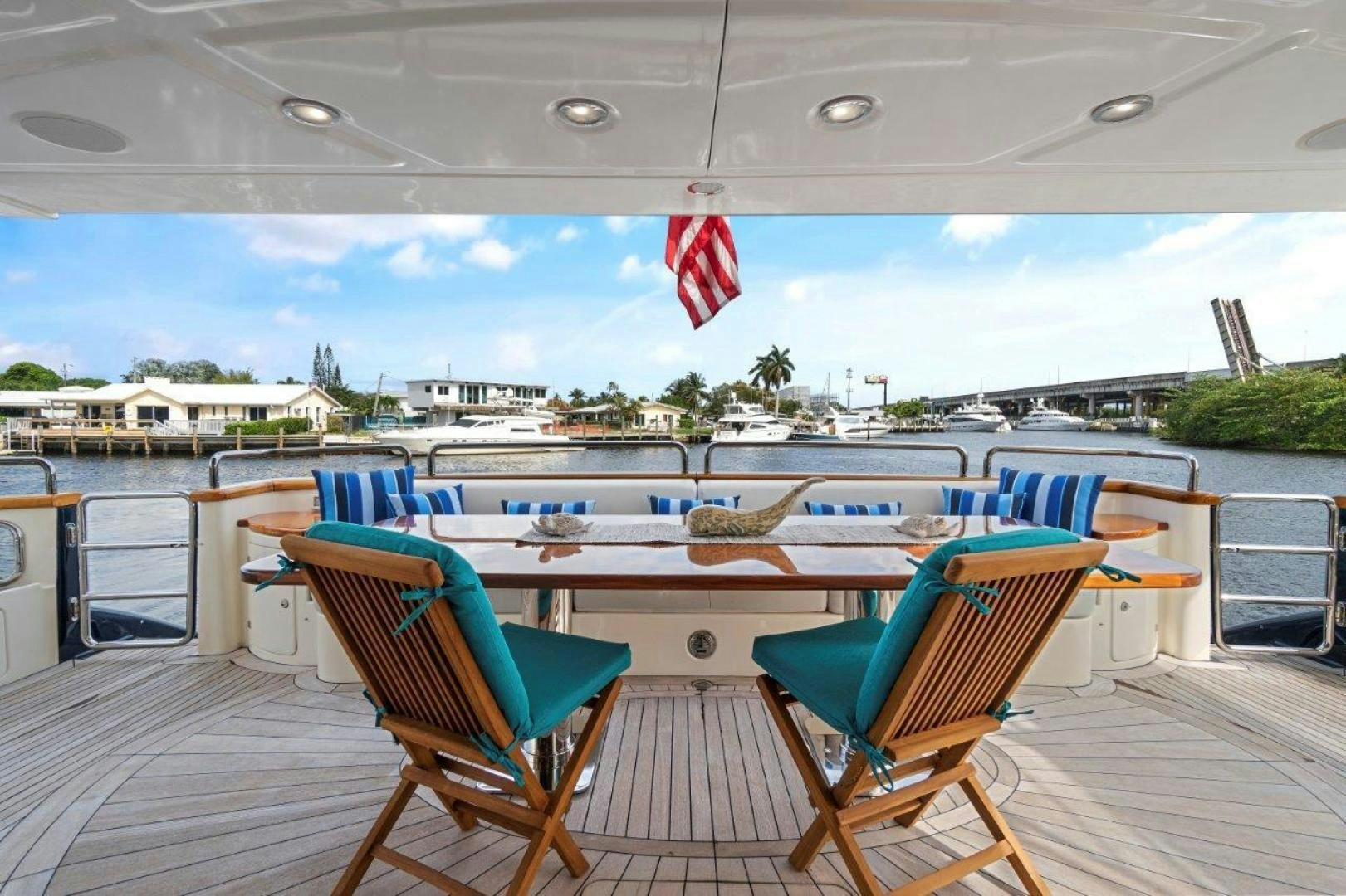 a deck with chairs and a pool aboard VIVERE Yacht for Sale