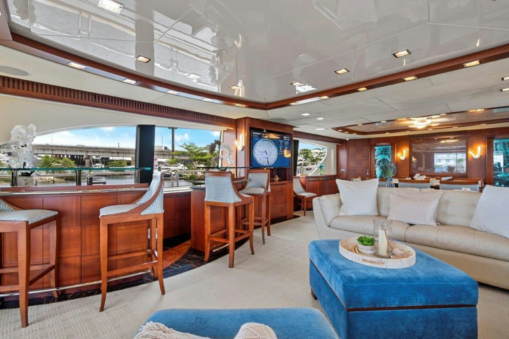a room with a couch and a table and chairs aboard VIVERE Yacht for Sale