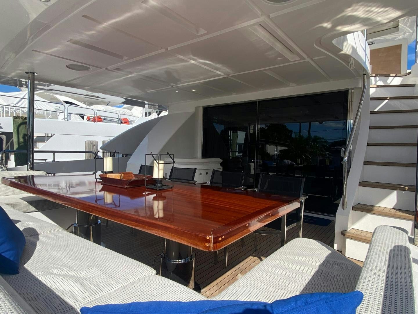a room with a table and chairs aboard LA TACHE Yacht for Sale