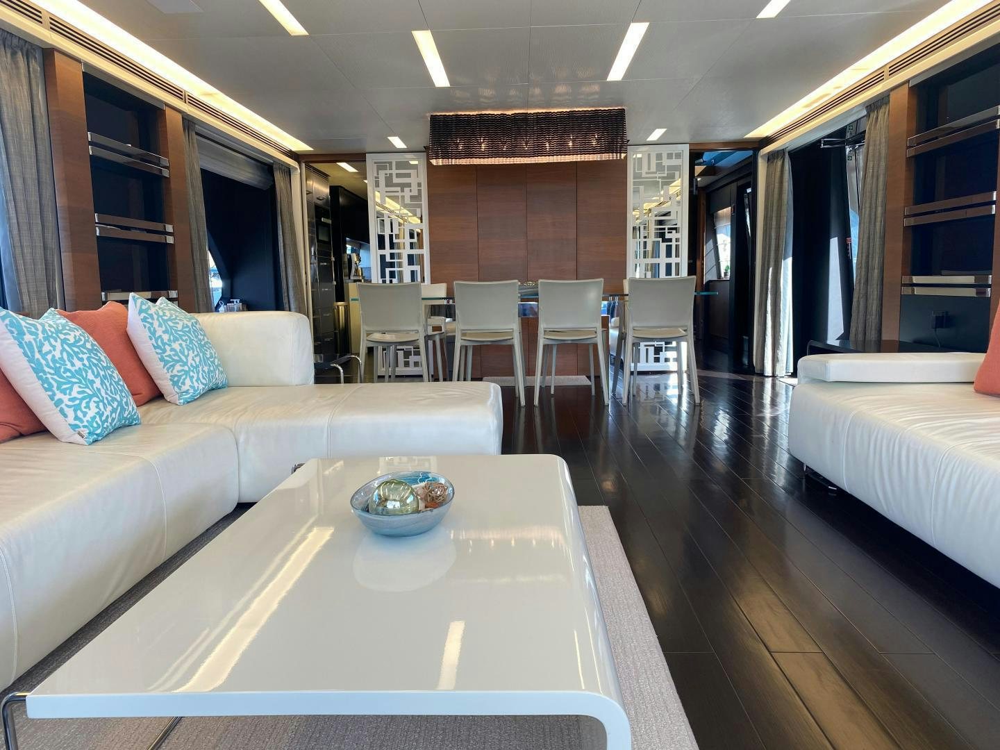 a room with a table and chairs aboard LA TACHE Yacht for Sale