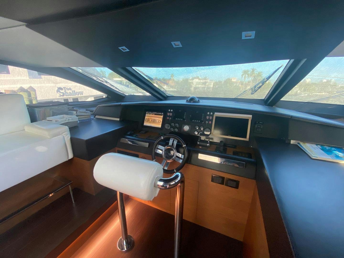 a vehicle with a seat and a desk with a view of a city aboard LA TACHE Yacht for Sale