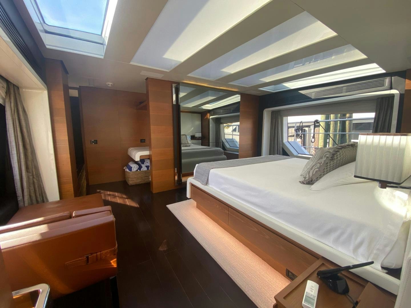 a room with a bed and a desk aboard LA TACHE Yacht for Sale