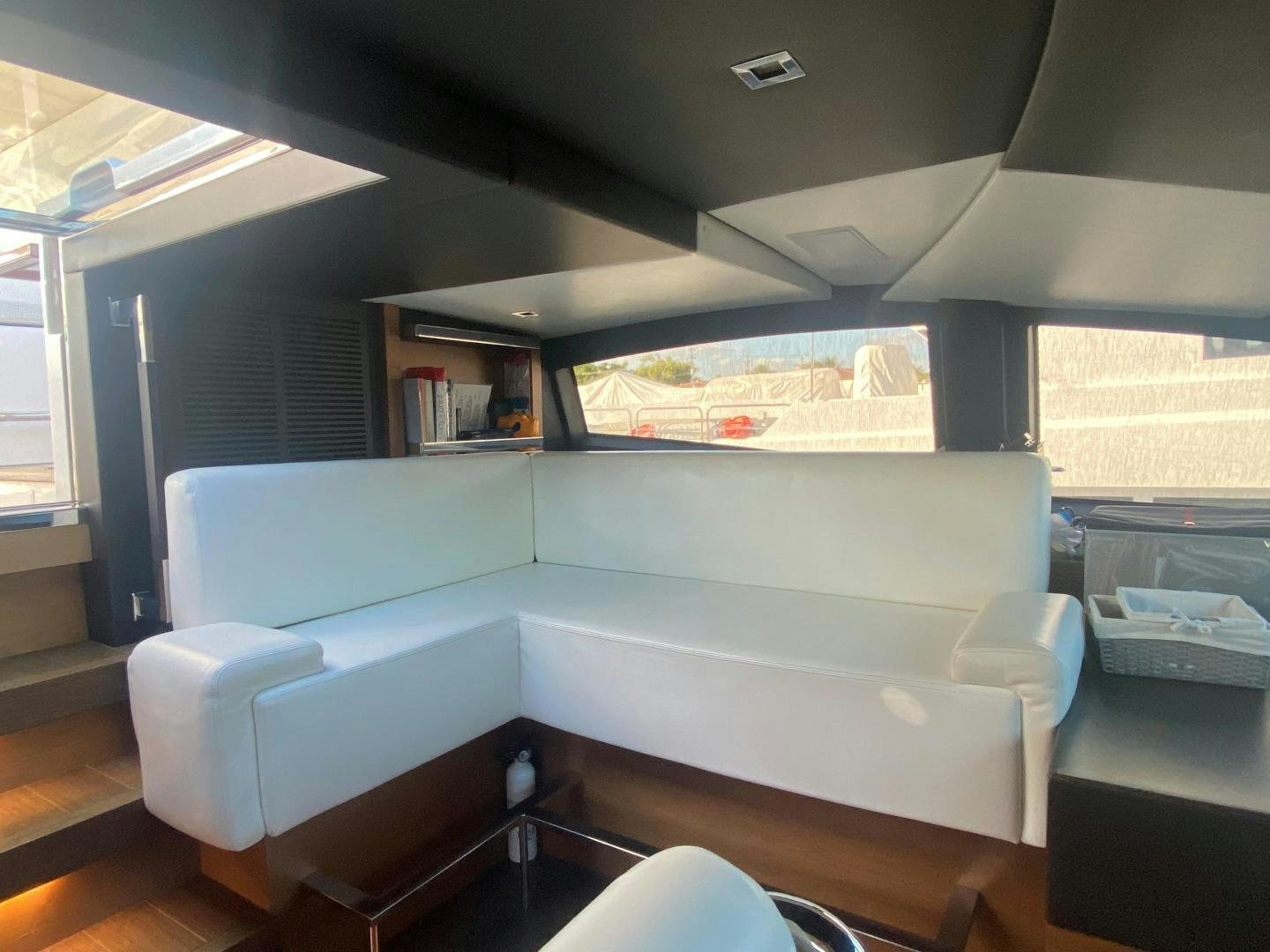 a room with a bed and a window aboard LA TACHE Yacht for Sale