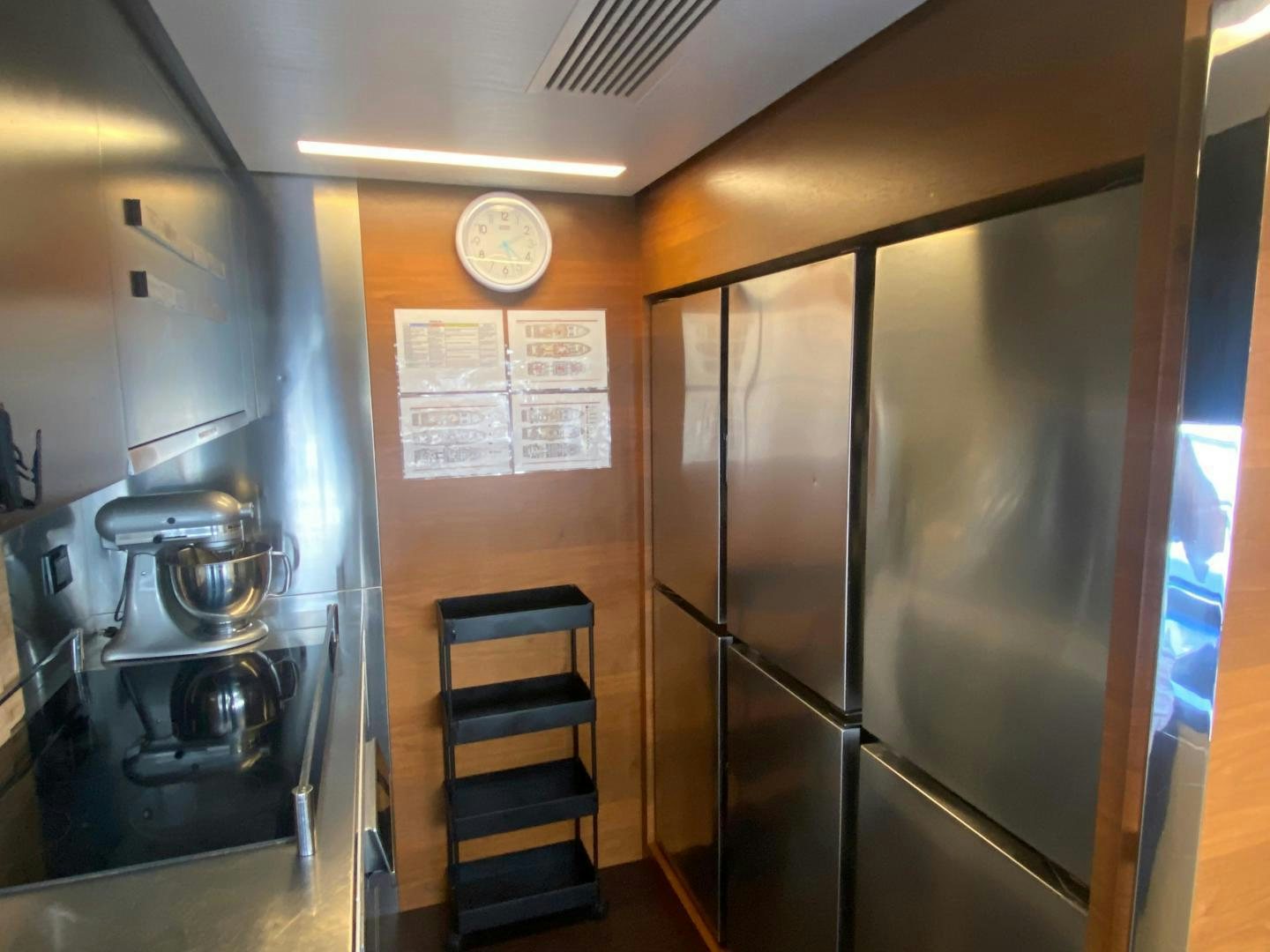a kitchen with a glass door aboard LA TACHE Yacht for Sale