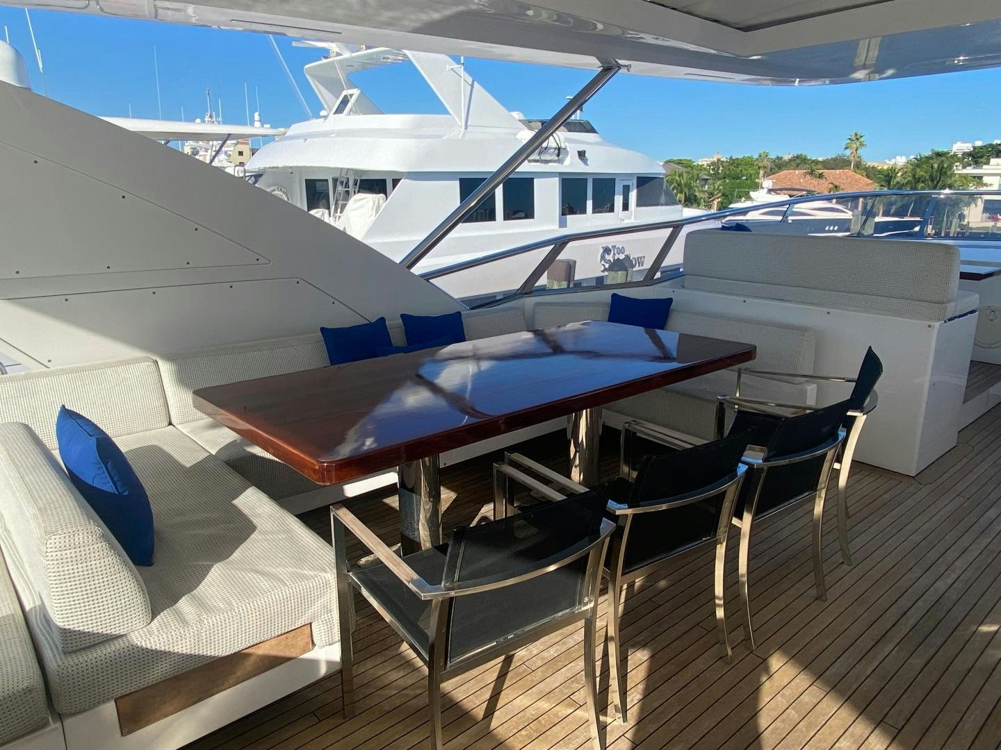 a deck with chairs and boats aboard LA TACHE Yacht for Sale