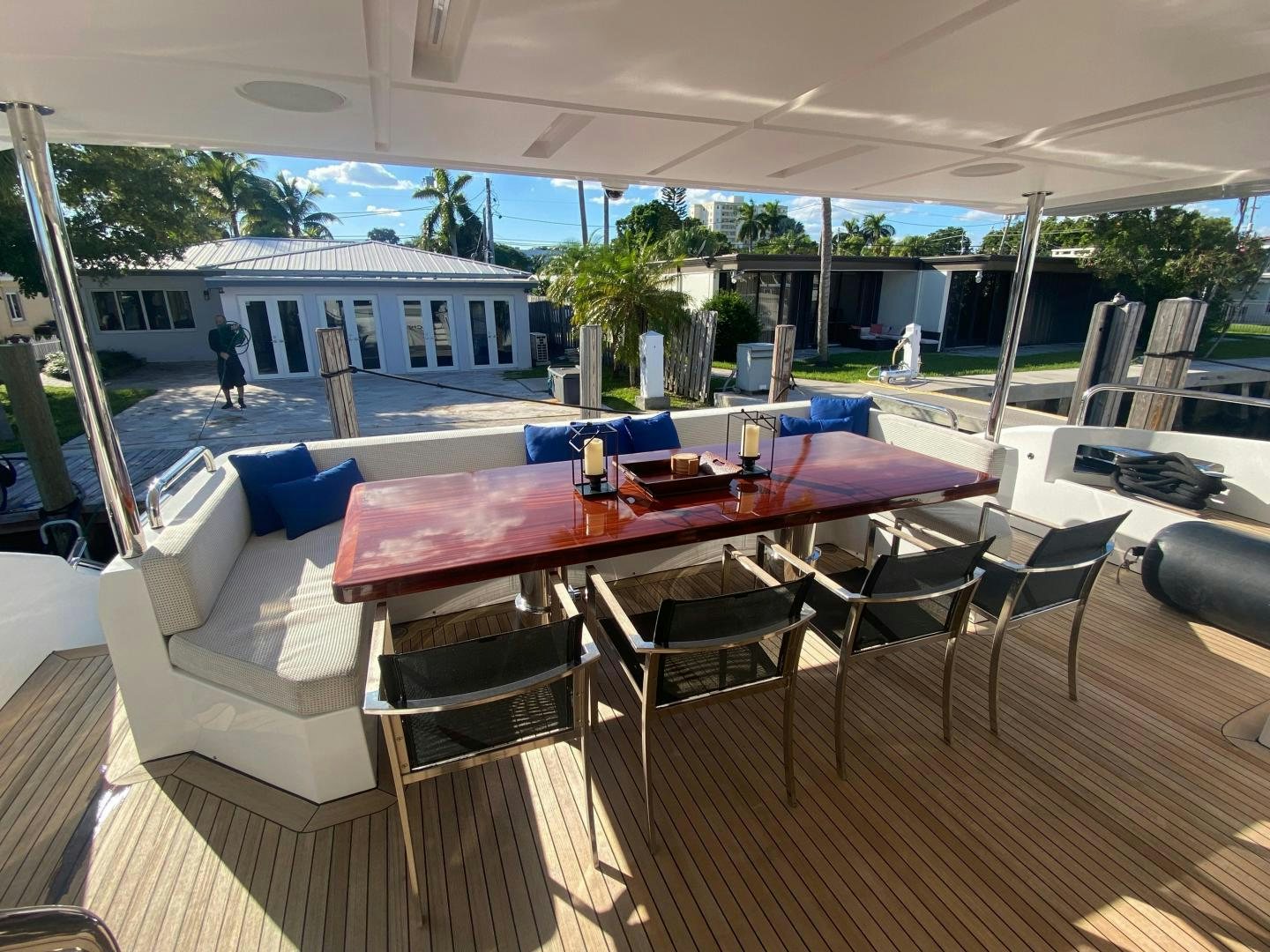 a table and chairs on a deck aboard LA TACHE Yacht for Sale