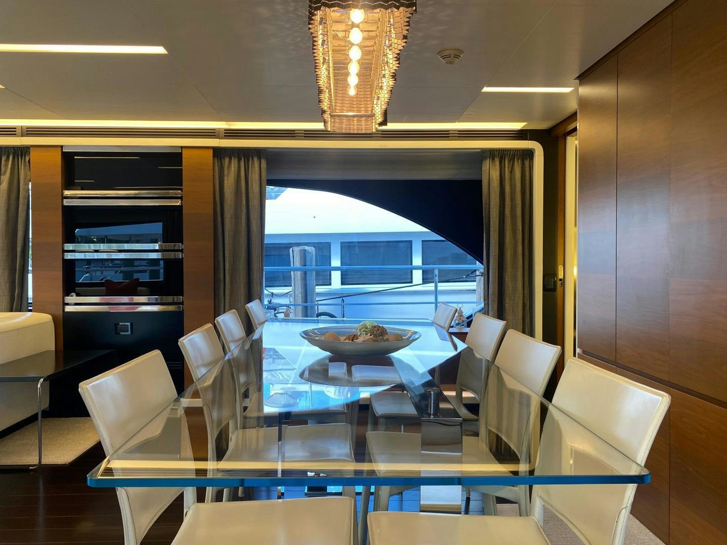 a room with a table chairs and a window aboard LA TACHE Yacht for Sale