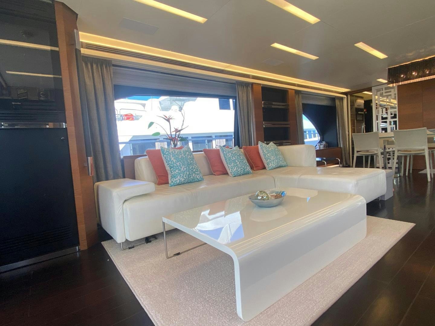 a living room with a large window aboard LA TACHE Yacht for Sale