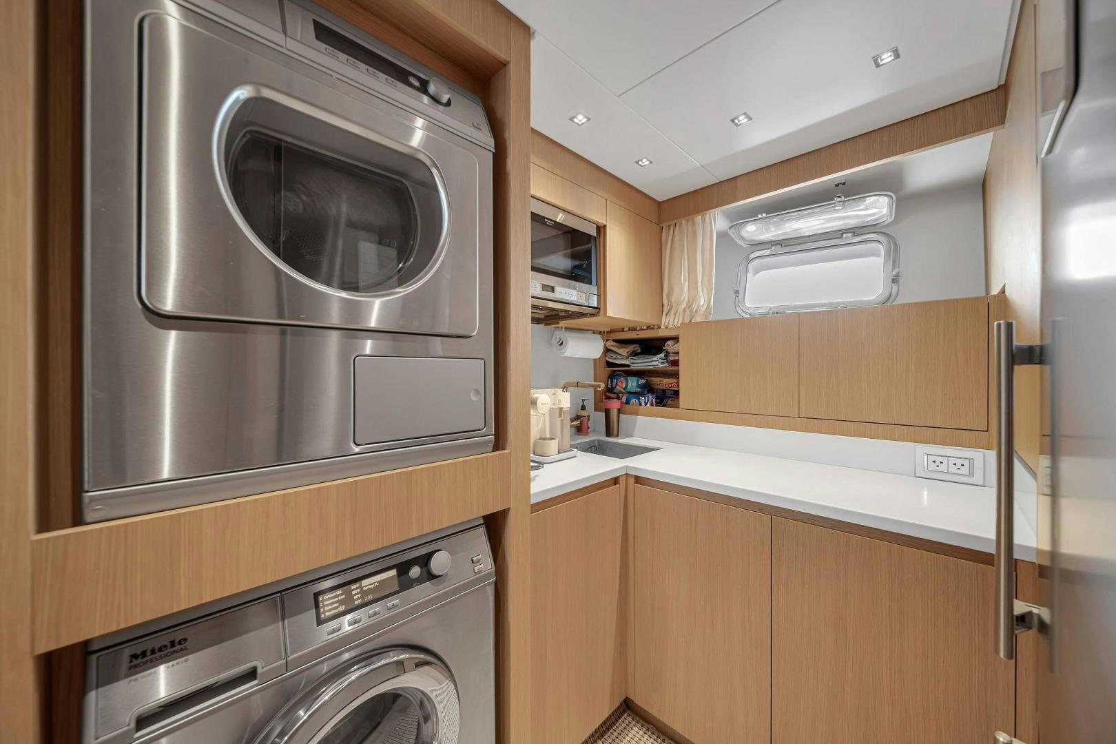 a kitchen with a microwave oven and a microwave aboard PEACEKEEPER Yacht for Sale