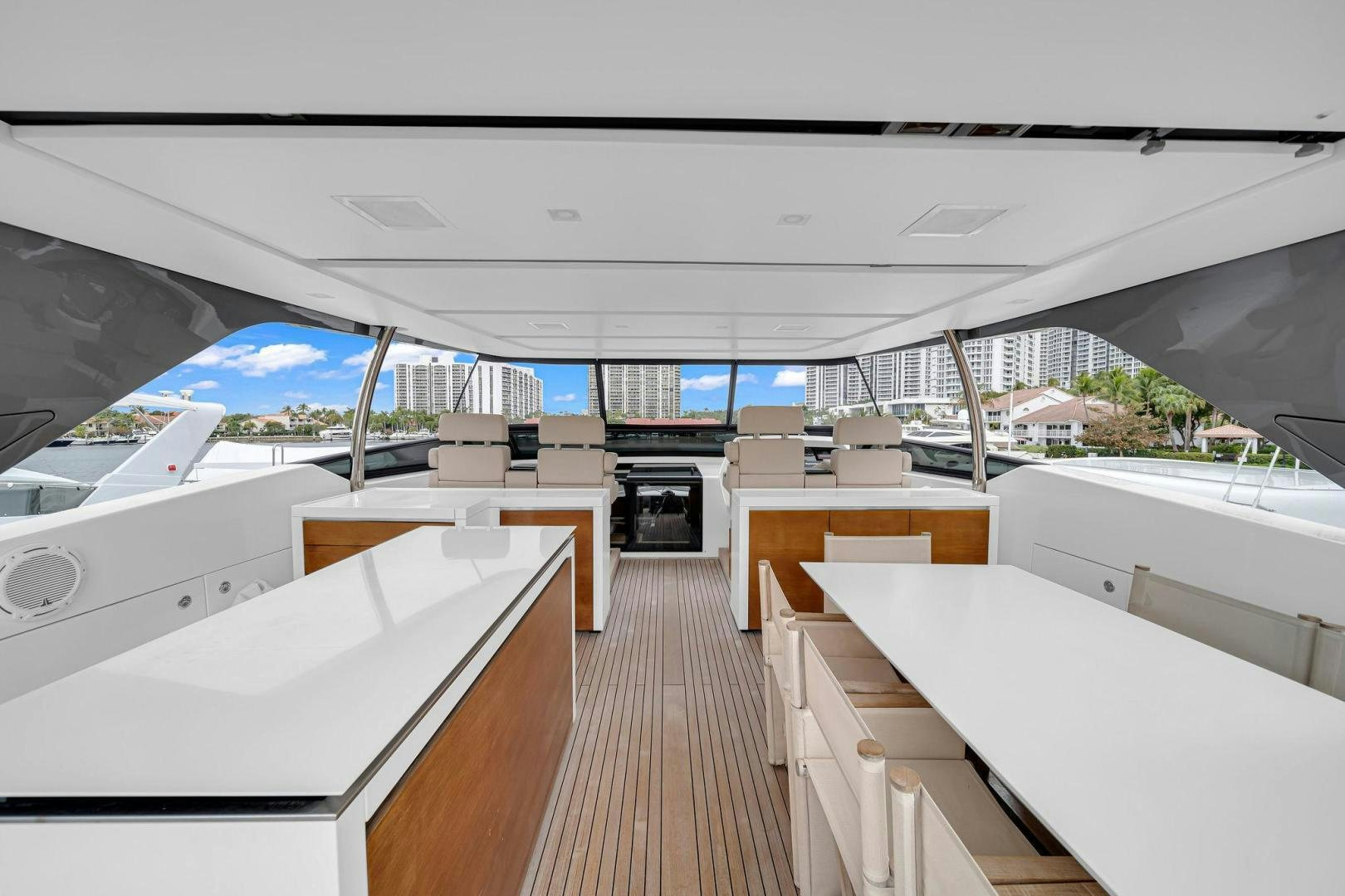 a room with a deck and a view of the water aboard PEACEKEEPER Yacht for Sale