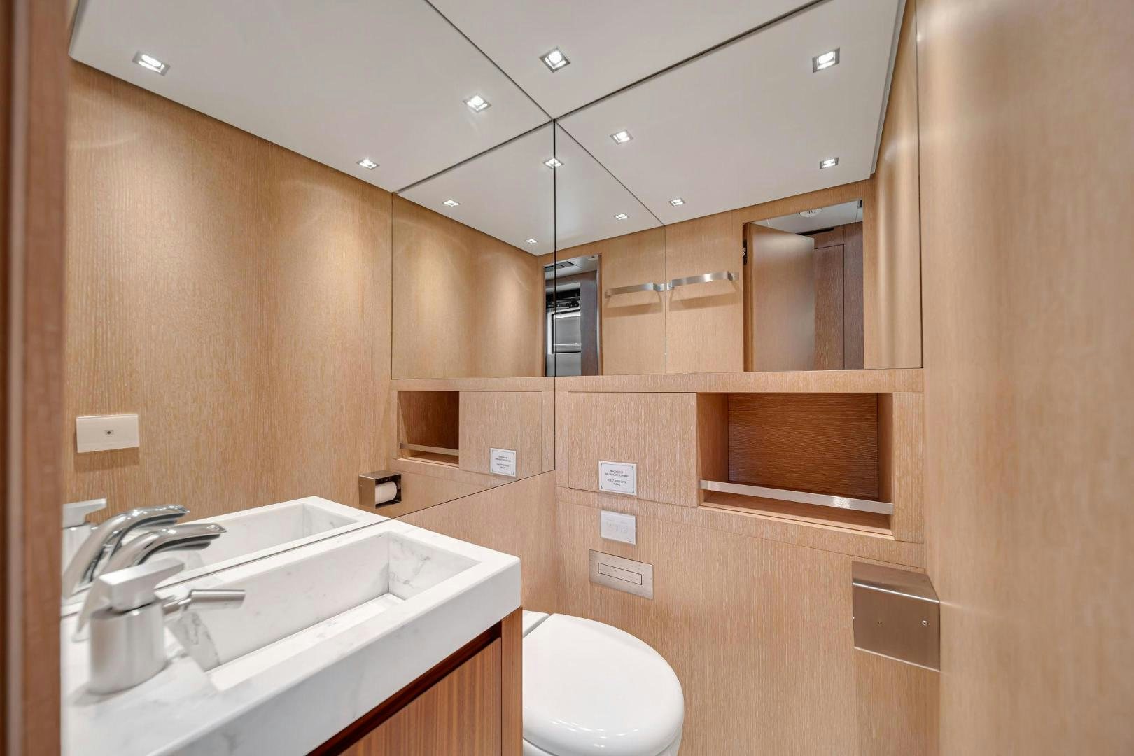 a bathroom with a sink and a toilet aboard PEACEKEEPER Yacht for Sale