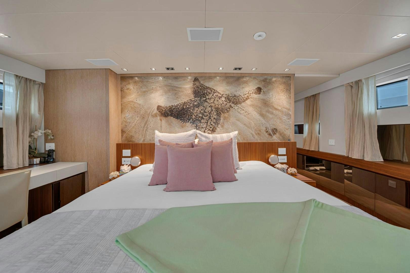 a hotel room with a large bed aboard PEACEKEEPER Yacht for Sale
