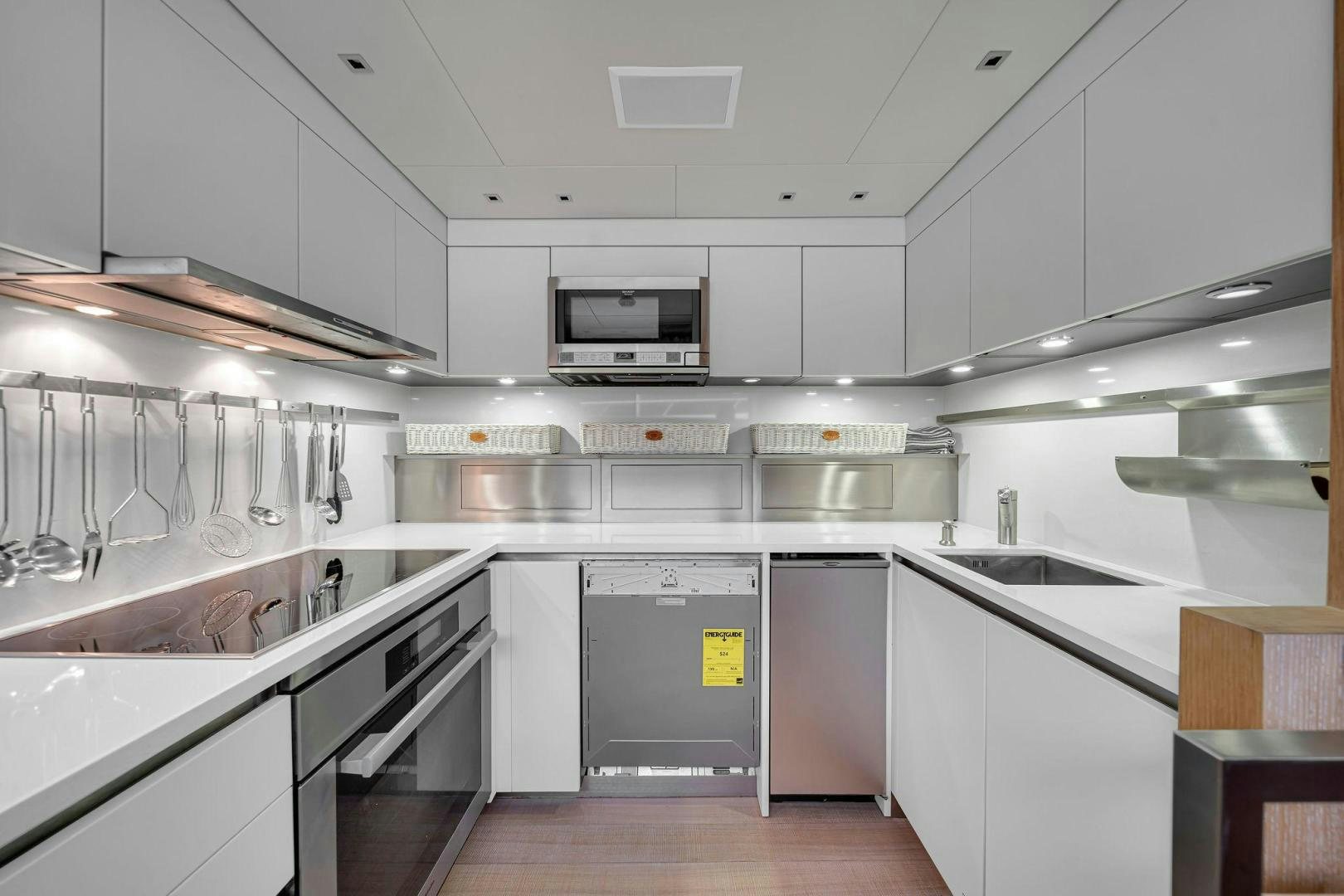 a kitchen with stainless steel appliances aboard PEACEKEEPER Yacht for Sale
