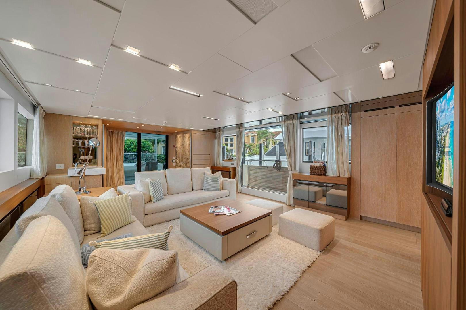 a living room with a couch and a coffee table aboard PEACEKEEPER Yacht for Sale