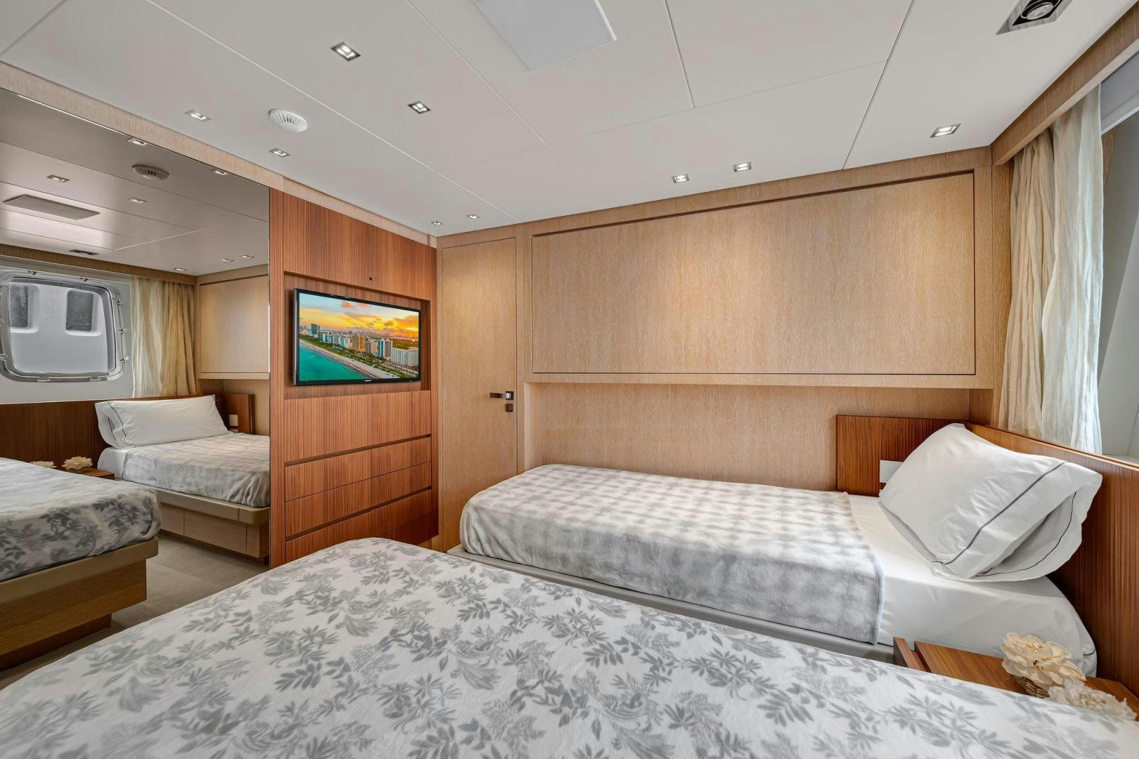 a room with a bed and a tv aboard PEACEKEEPER Yacht for Sale