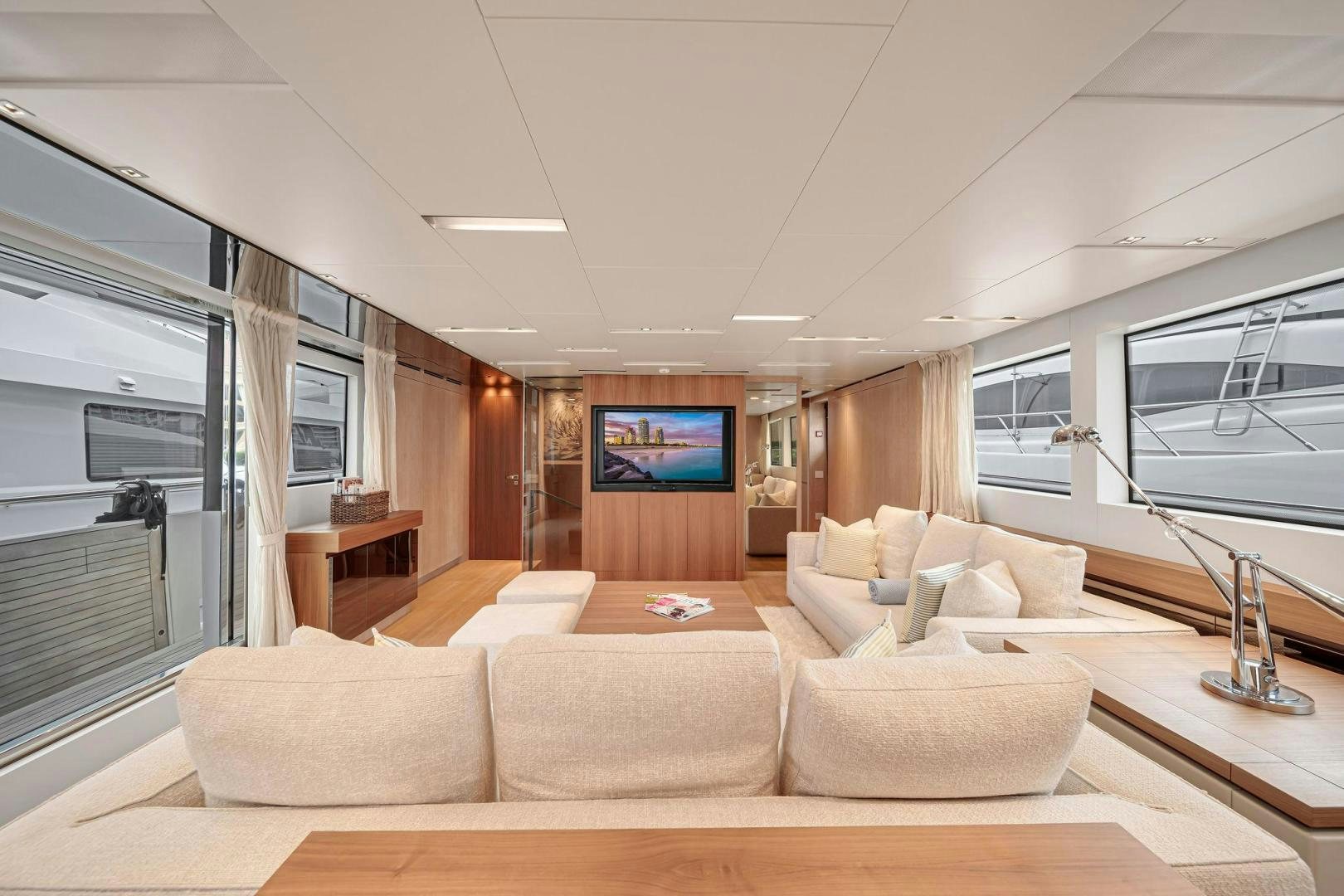 a living room with a large screen aboard PEACEKEEPER Yacht for Sale