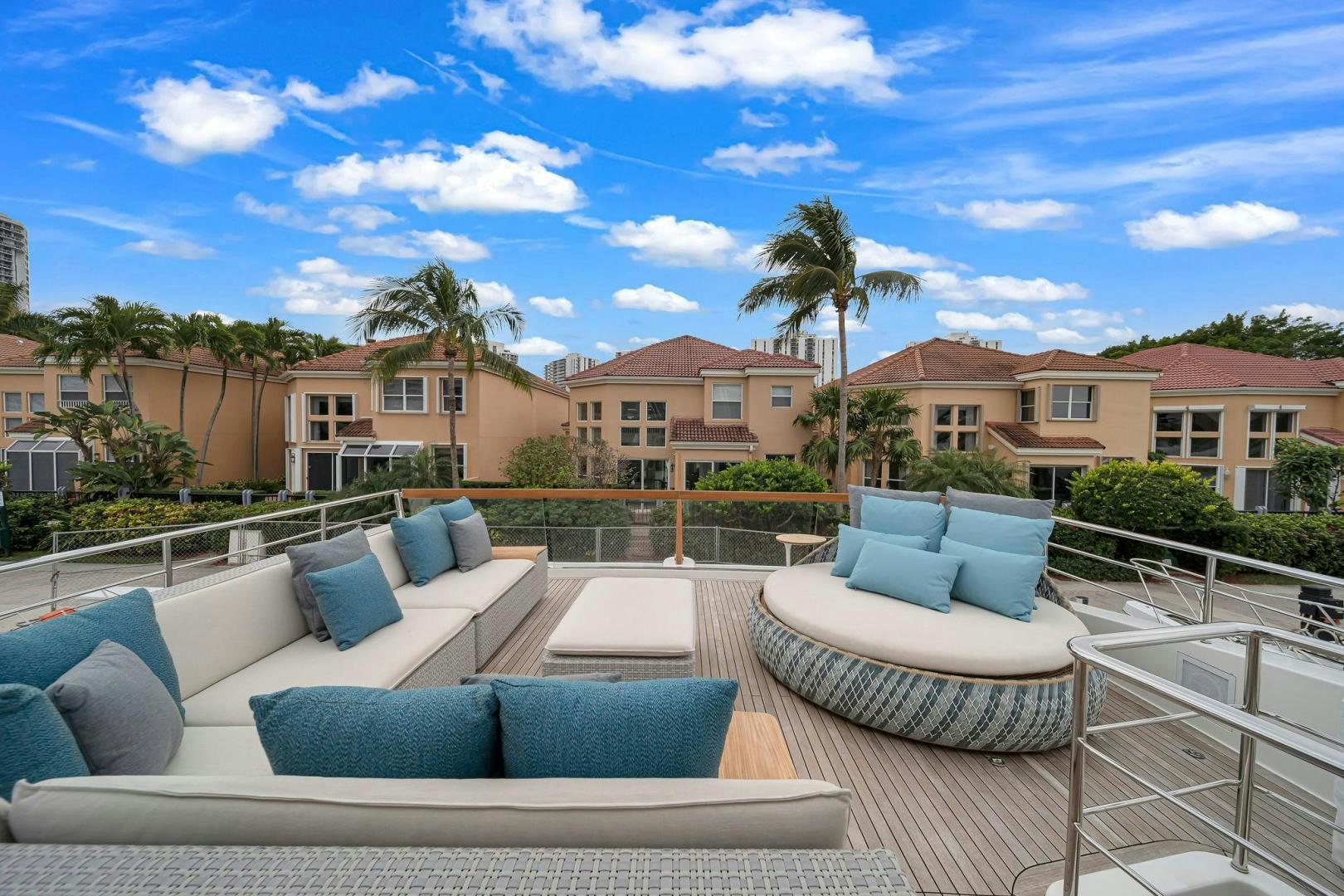 a patio with a couch and a pool aboard PEACEKEEPER Yacht for Sale