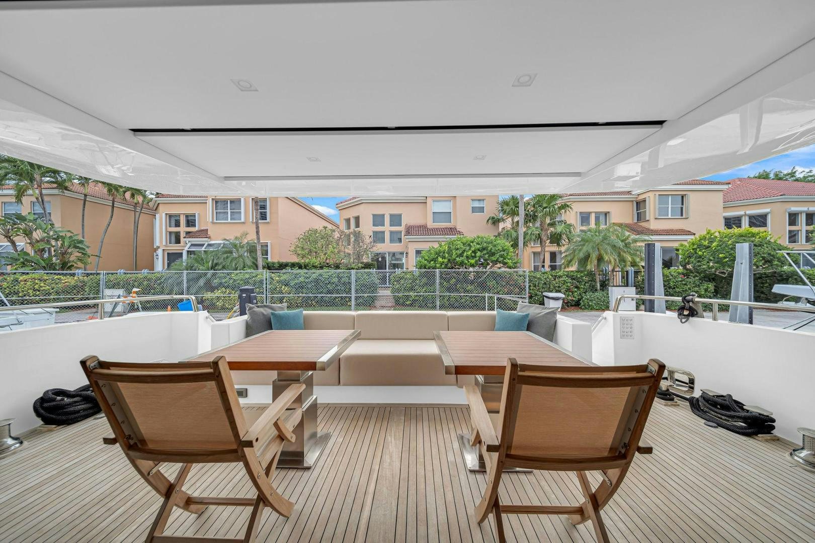a deck with chairs and tables aboard PEACEKEEPER Yacht for Sale