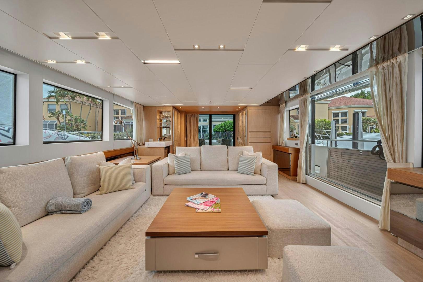 a living room with a large glass window aboard PEACEKEEPER Yacht for Sale