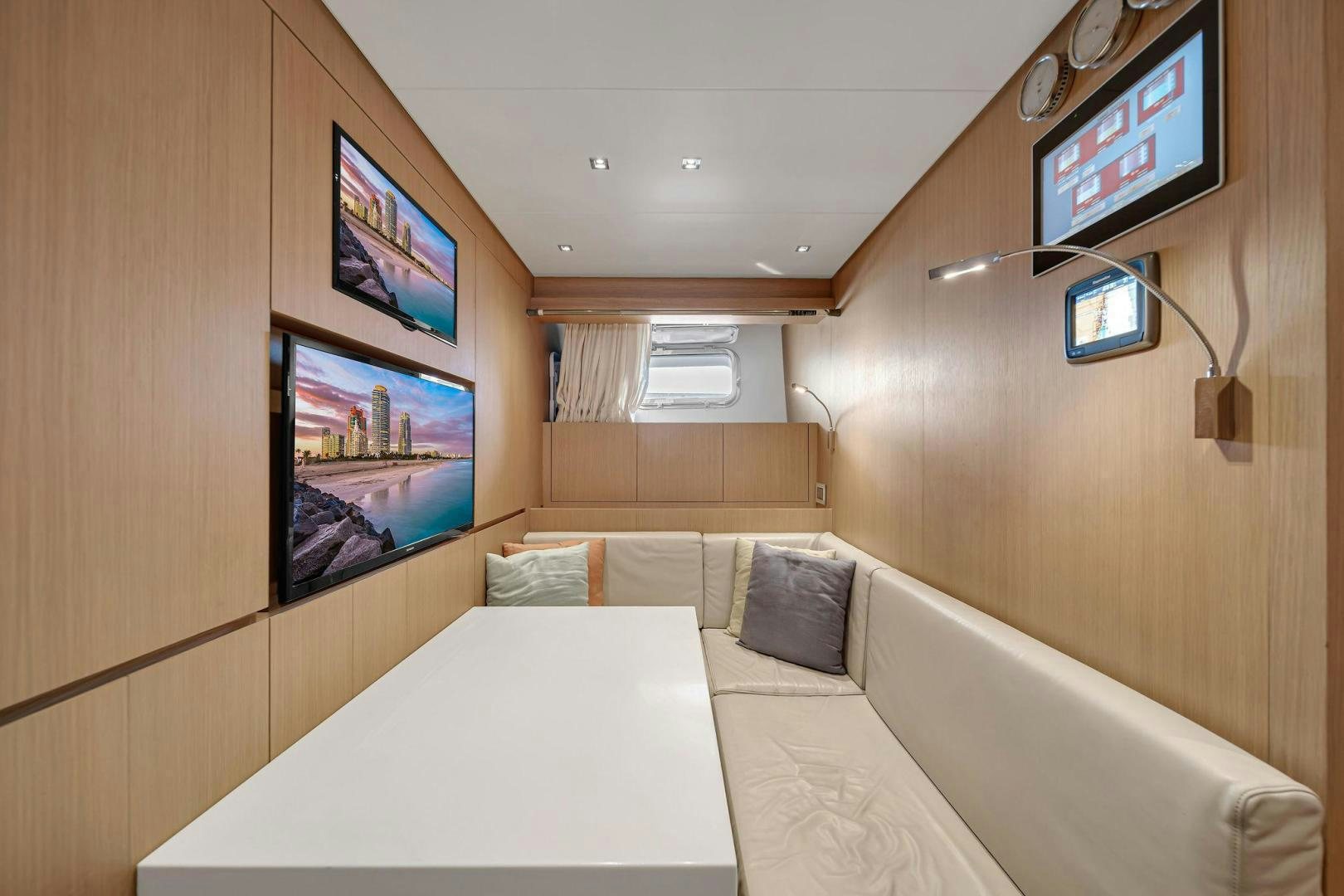 a room with a bed and tv aboard PEACEKEEPER Yacht for Sale