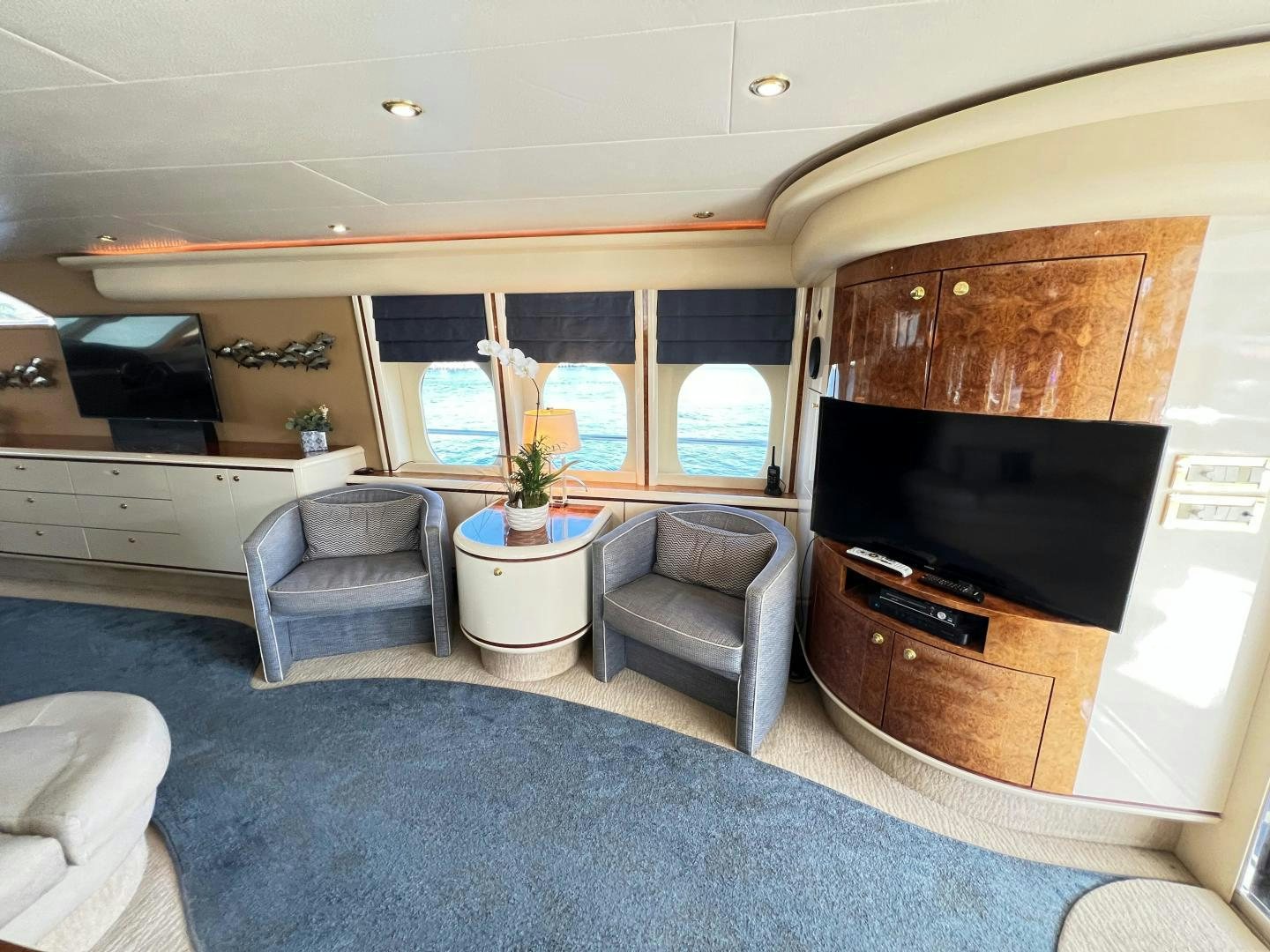a living room with a fireplace aboard MAGIC MOMENTS Yacht for Sale