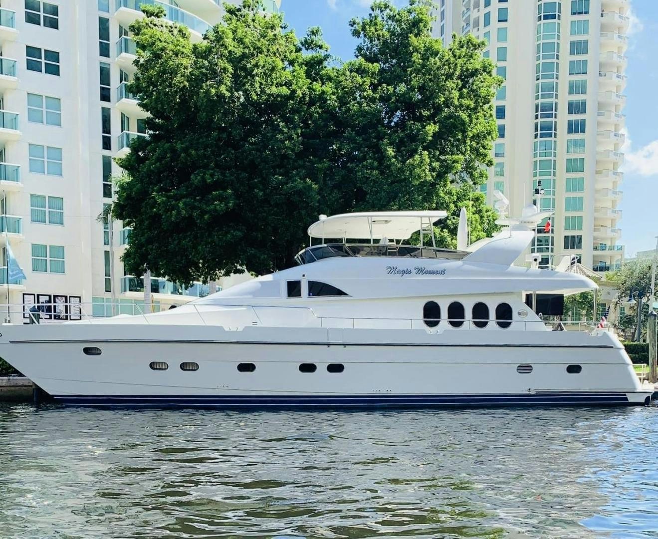 a white boat on the water aboard MAGIC MOMENTS Yacht for Sale