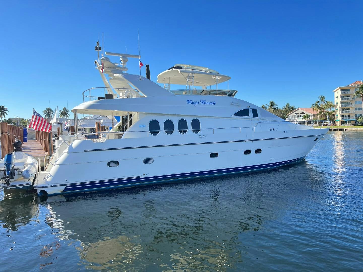 a large white boat in the water aboard MAGIC MOMENTS Yacht for Sale