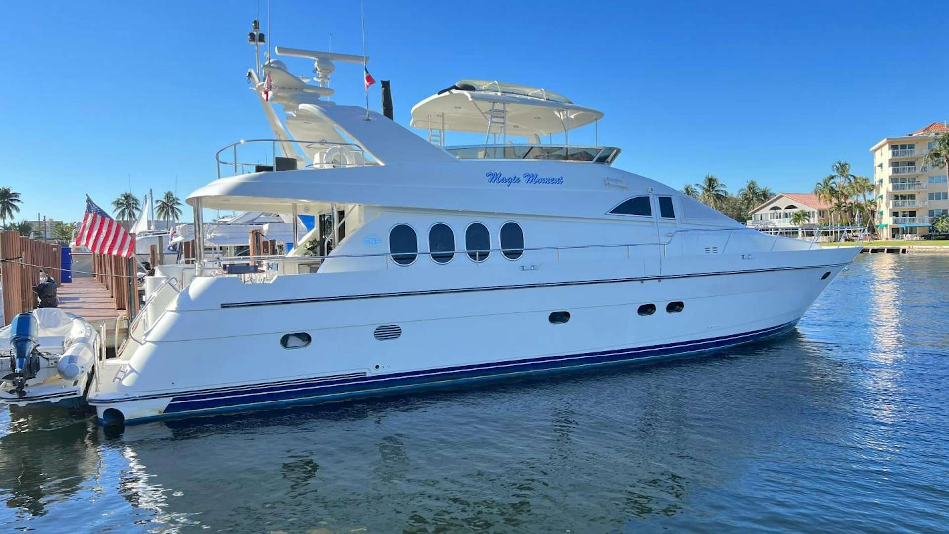 a large white boat in the water aboard MAGIC MOMENTS Yacht for Sale
