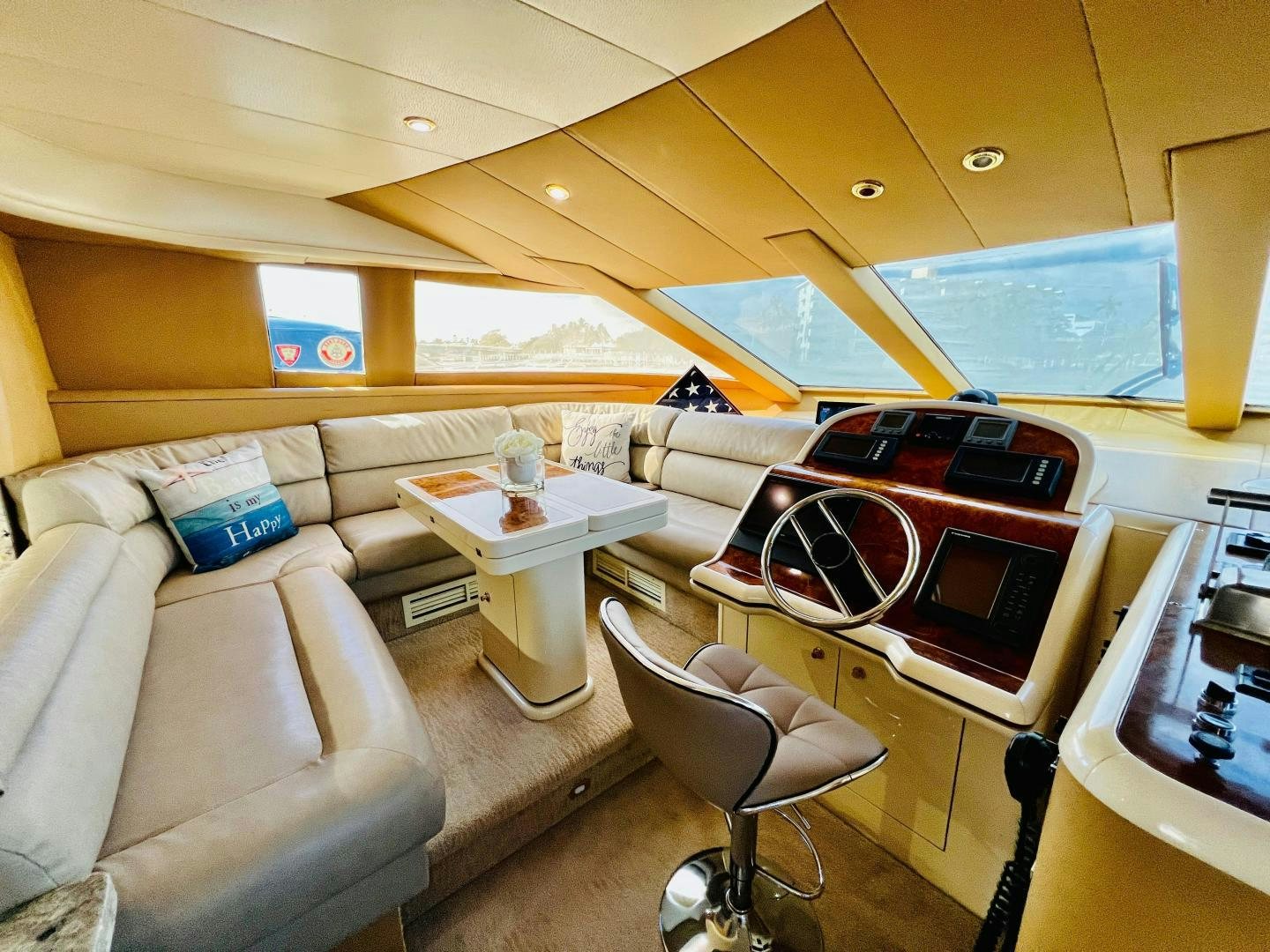 a living room with a couch and a table aboard MAGIC MOMENTS Yacht for Sale