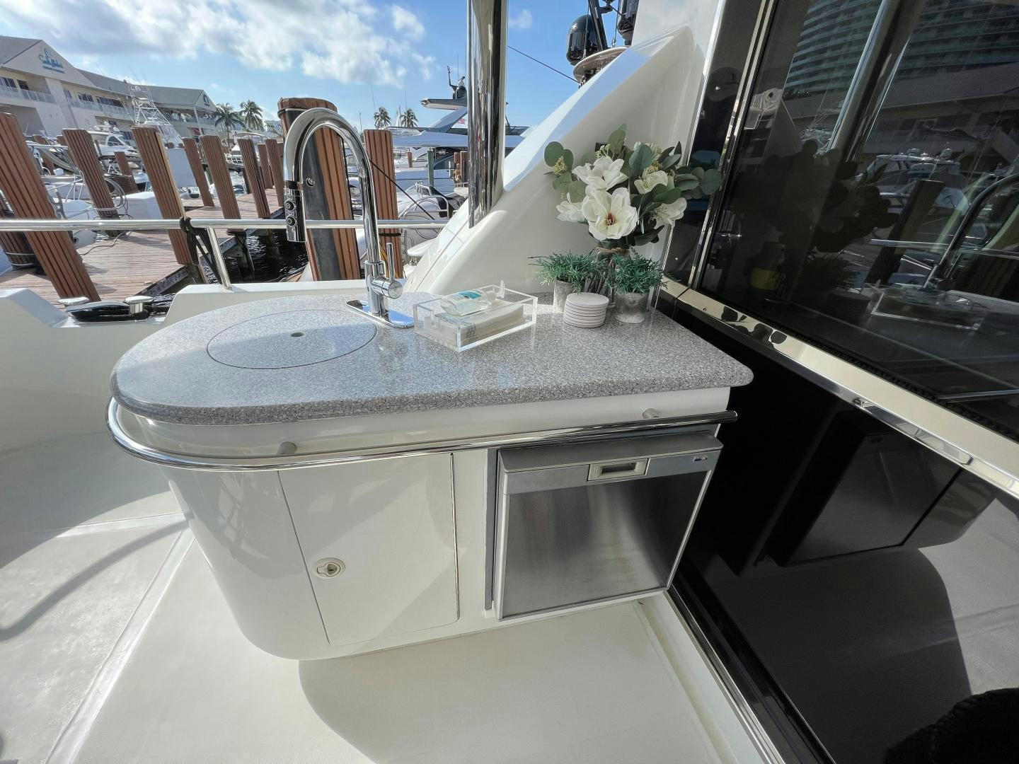 a kitchen with a sink and a window aboard MAGIC MOMENTS Yacht for Sale