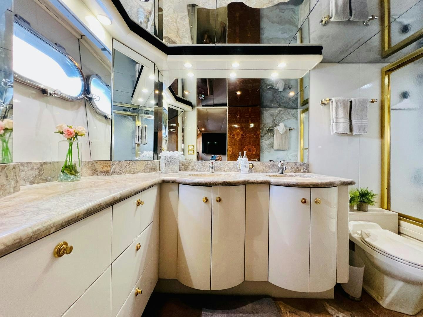 a bathroom with a large mirror aboard MAGIC MOMENTS Yacht for Sale