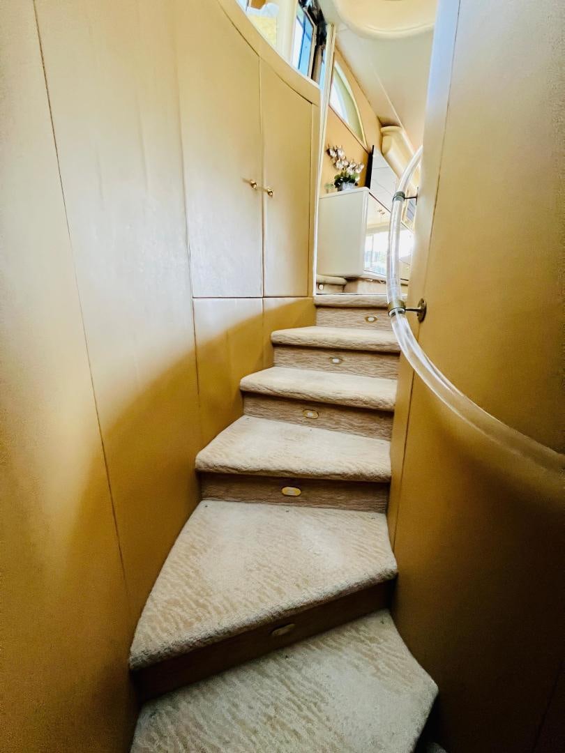 a staircase with a railing aboard MAGIC MOMENTS Yacht for Sale