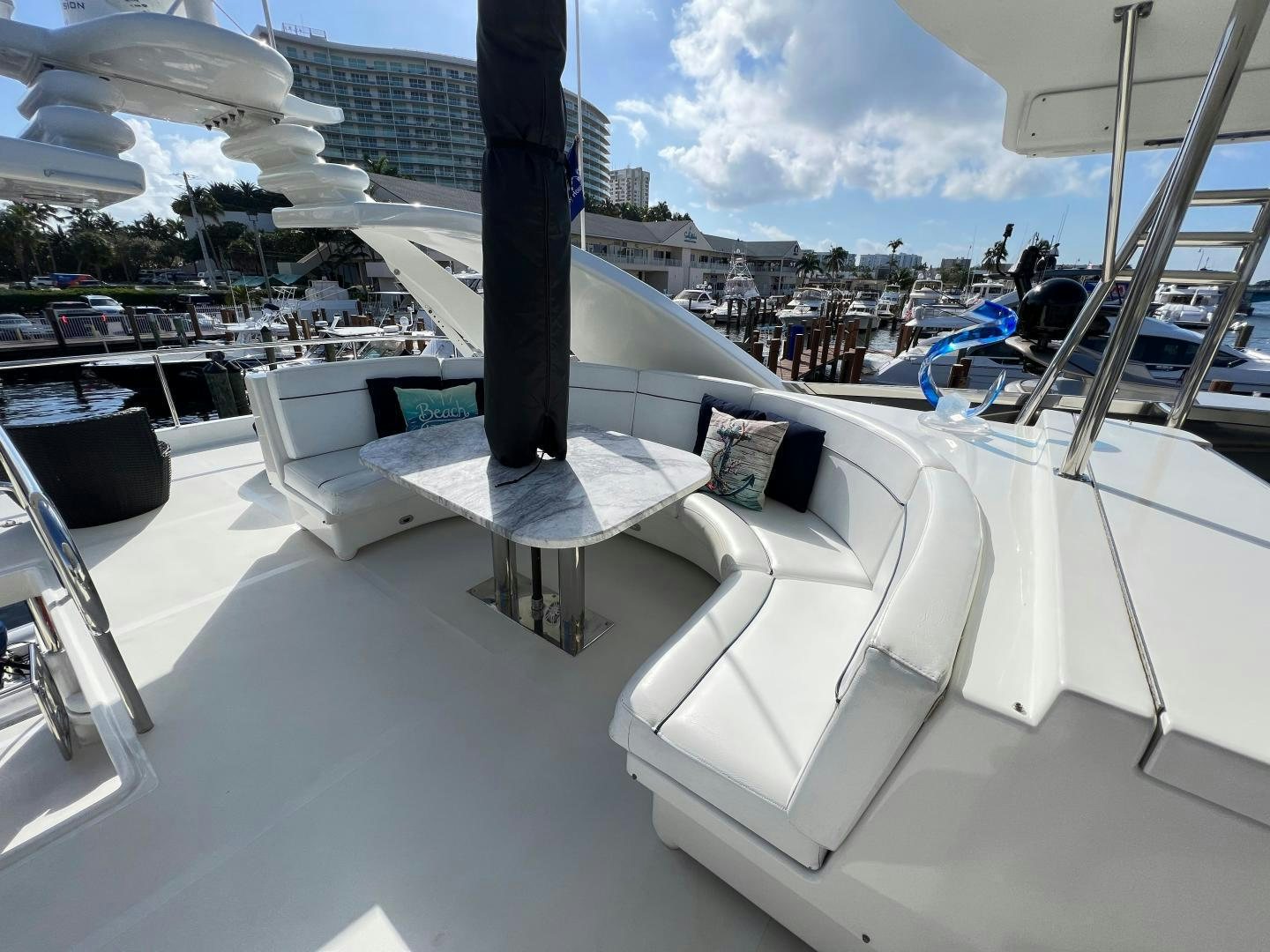 a white lounge chair on a boat aboard MAGIC MOMENTS Yacht for Sale